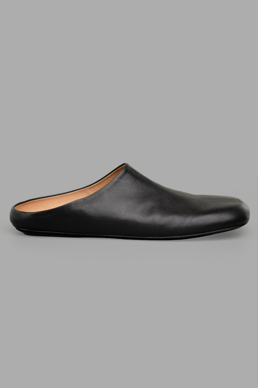 Marsèll Leather Mules in black, side view. Handmade with natural leather, showcasing artisanal Italian craftsmanship.