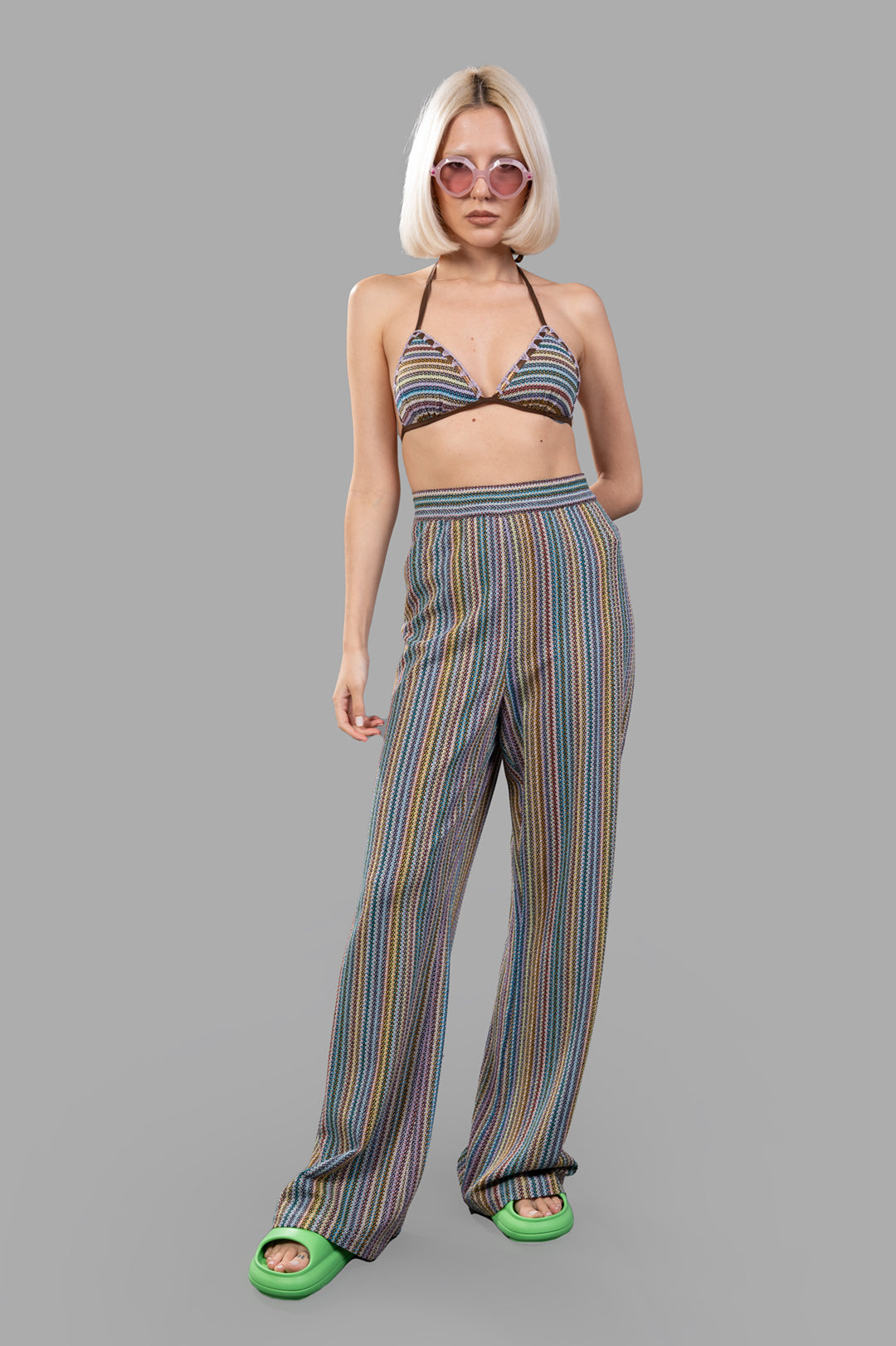 Anjuna Striped Knit Trousers on model, featuring multicolor pattern with fluid silhouette, embodying effortless.
