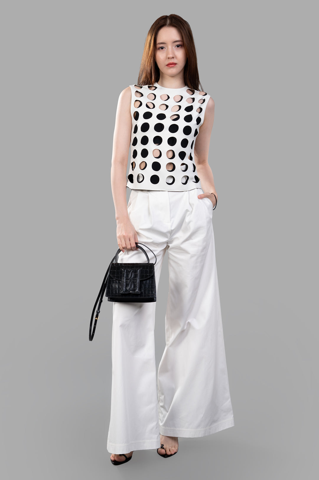 A.W.A.K.E. MODE Top with Layered Holes, sleeveless, front view. White with cut-out detailing, round neckline.
