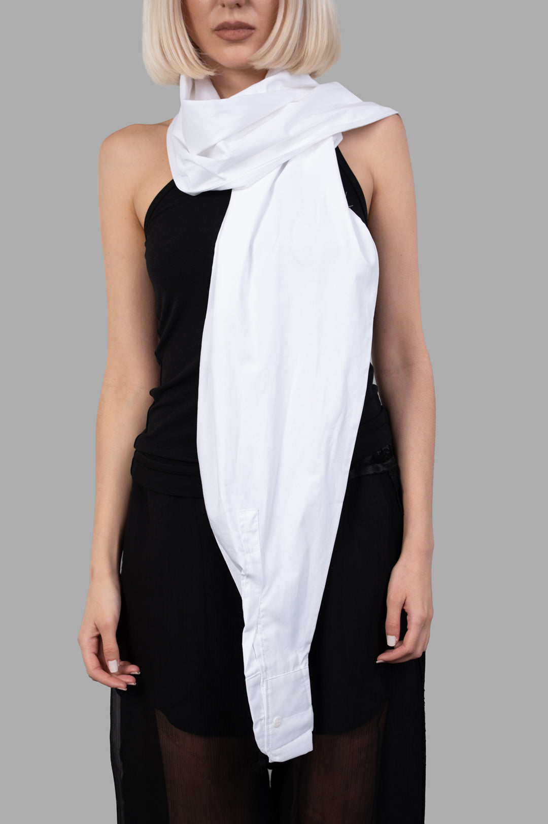 Giovanni Cavagna Sleeve Top styled as a scarf, showcased in white 100% cotton on a model against a gray background.