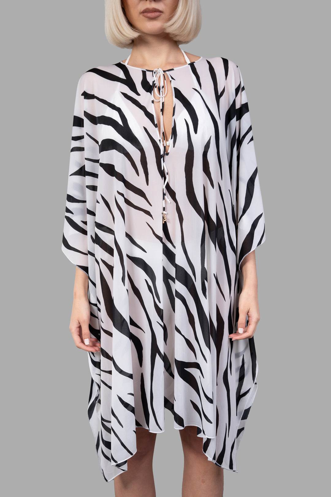 Fisico Zebra Bikini Cover Up features a flowing design with black and white stripes, showcasing luxury fabric on a model.