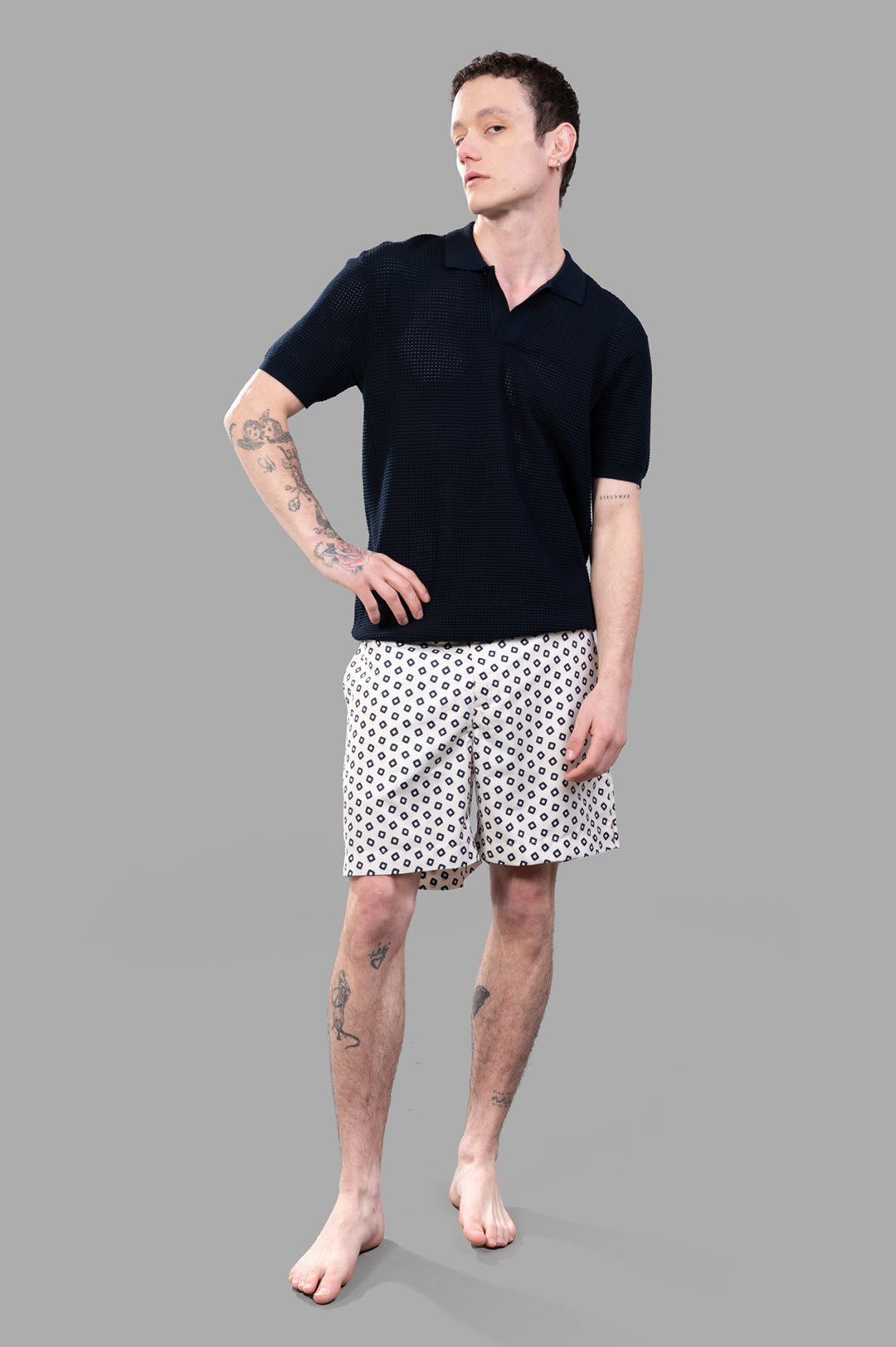 Orlebar Brown Waffle Mesh Polo Shirt in Night Iris, modeled front view, showcasing textured knit and open placket.