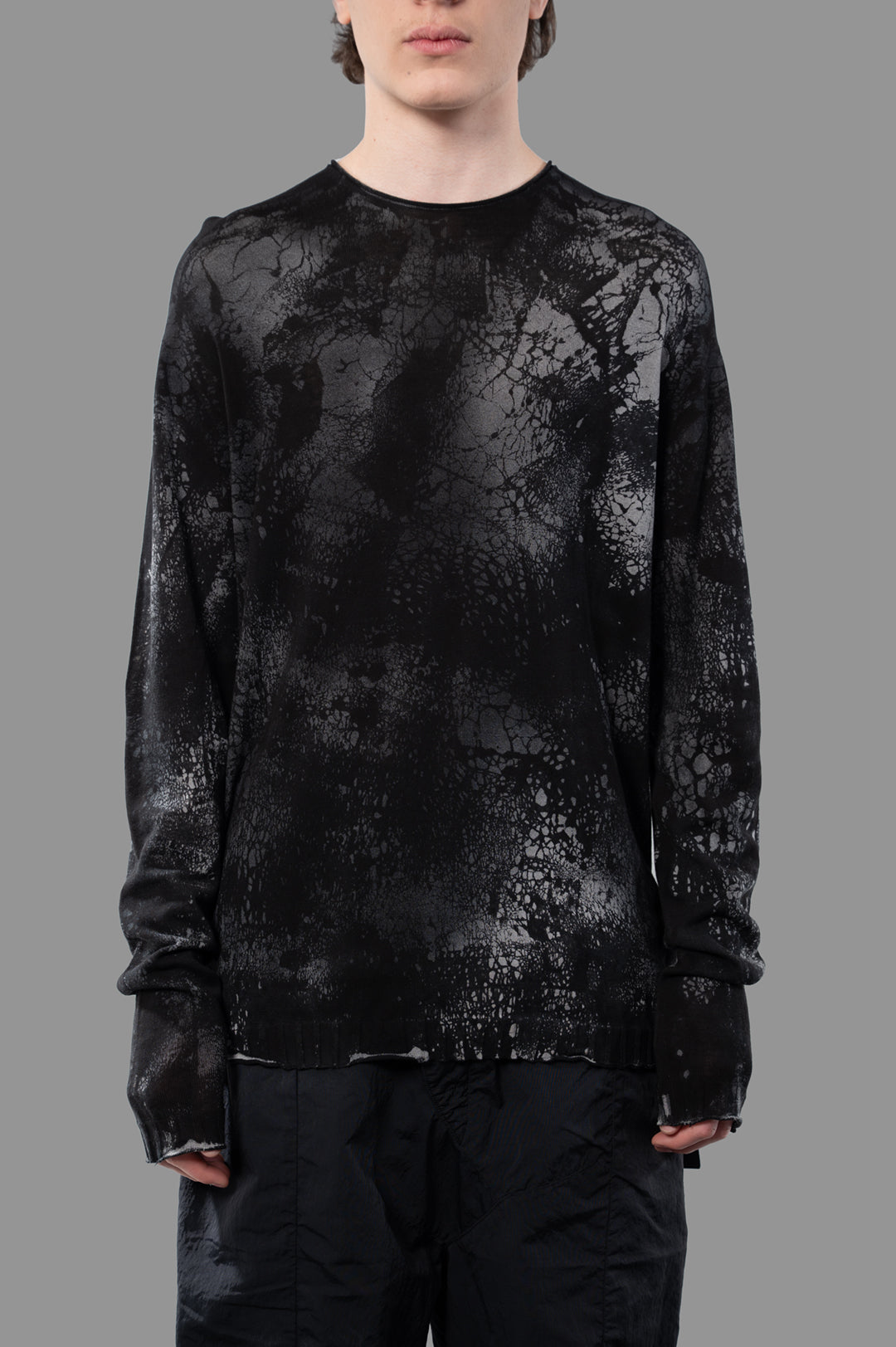 MD 75 Abstract-print Sweater featured on model, showcasing a black and gray textured design with a relaxed fit.