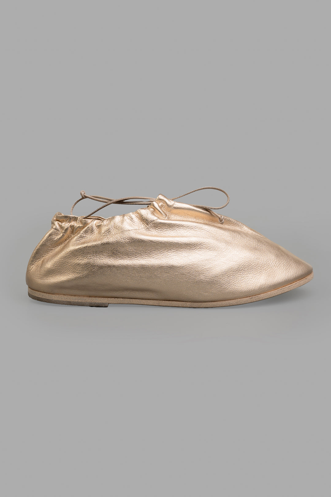 Marsèll Drawstring Shoes in gold leather, side view, showcasing artisanal Italian craftsmanship and sculptural design.