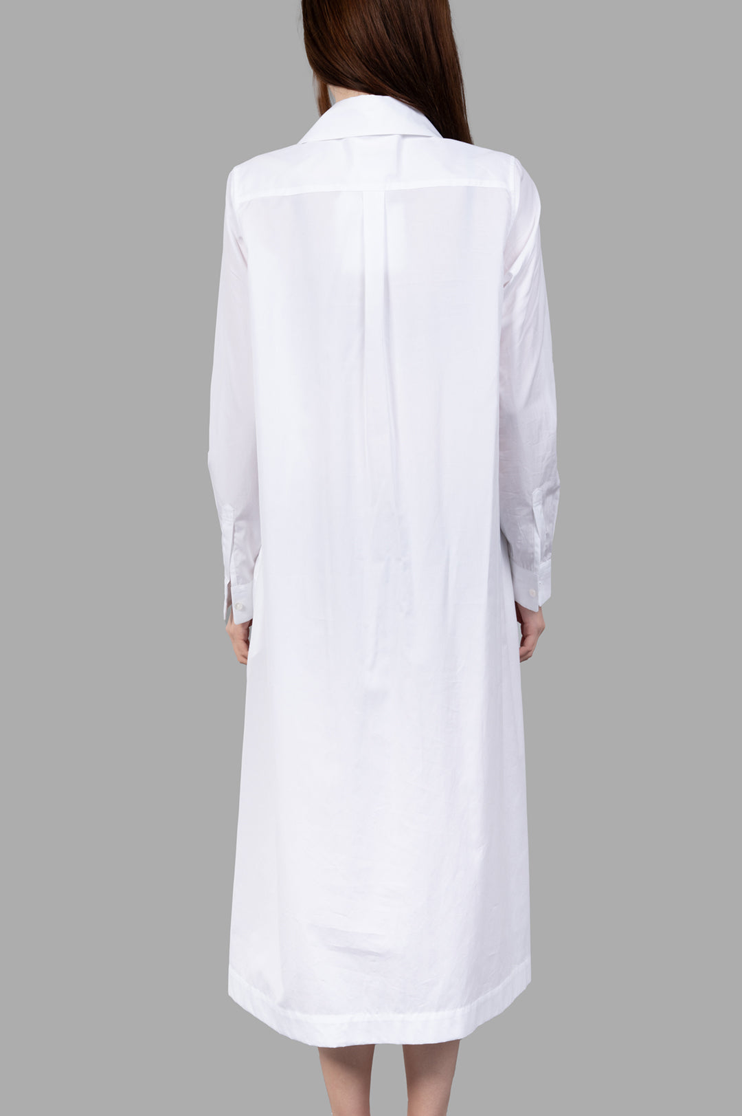 Noir Kei Ninomiya Charm-collar Shirt Dress, white with an exaggerated collar, showing buttons and long sleeves from the back.