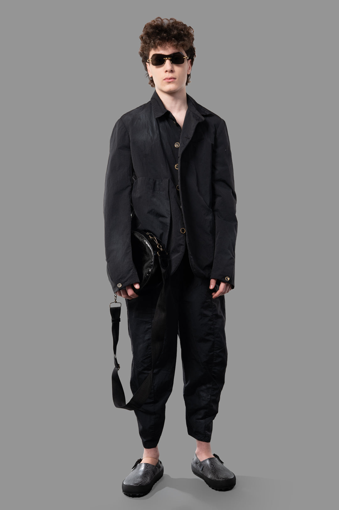 Marc Point Oversized Cargo Jacket in black nylon, modeled front view, highlighting relaxed fit and flowing silhouette.