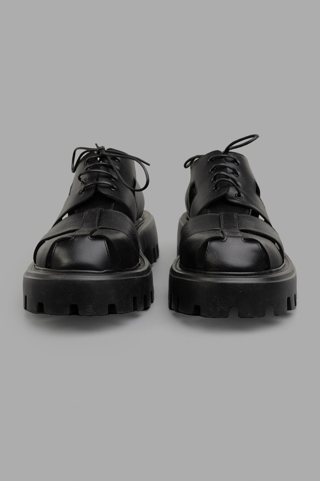 Mattia Capezzani Iron Black Shoes showcased from the front, featuring rugged soles and a sleek leather design.