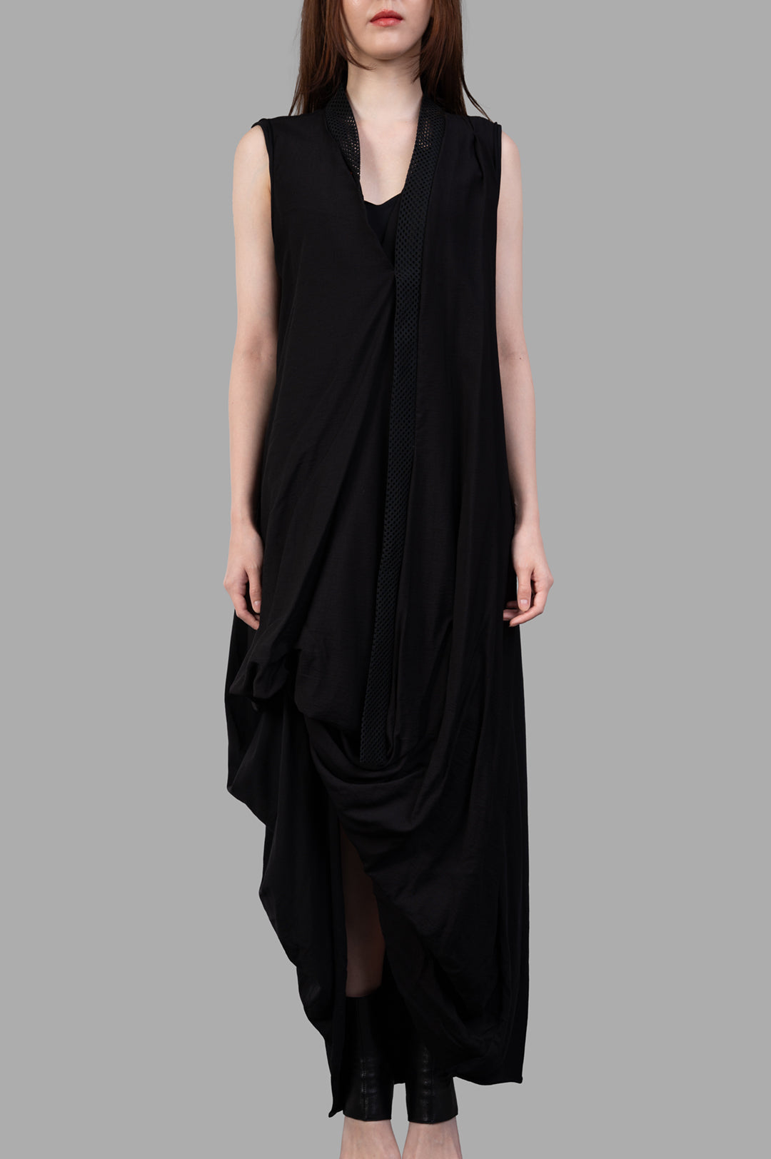 Giovanni Cavagna Asymmetric Dress in Black on model, showcasing a front view with unique draping and sleeveless design.