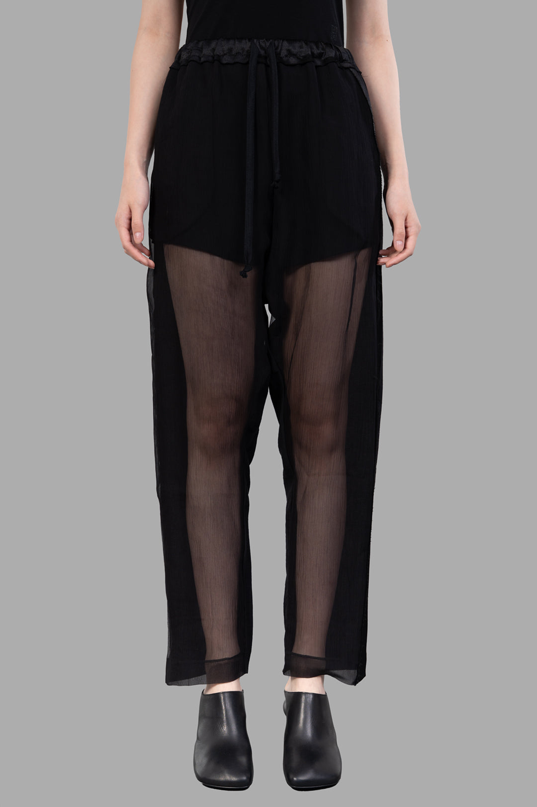 Giovanni Cavagna Semi-sheer Pants displayed on a model, featuring a relaxed fit with an elastic waistband and breathable.