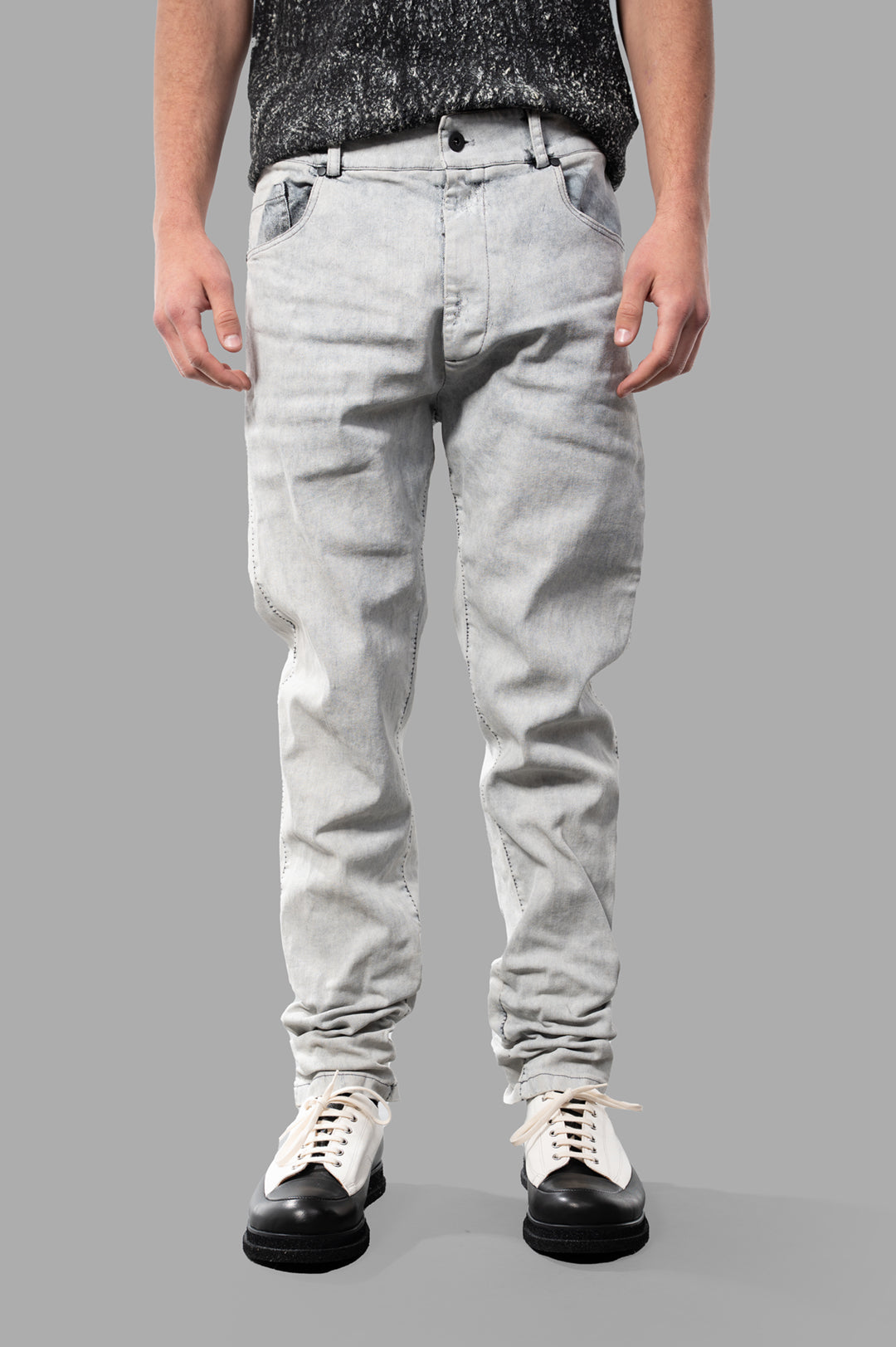 MD 75 Coated Jeans in white, showcasing a stylish front view with a relaxed fit and detailed texture. Perfect for luxe casual wear.