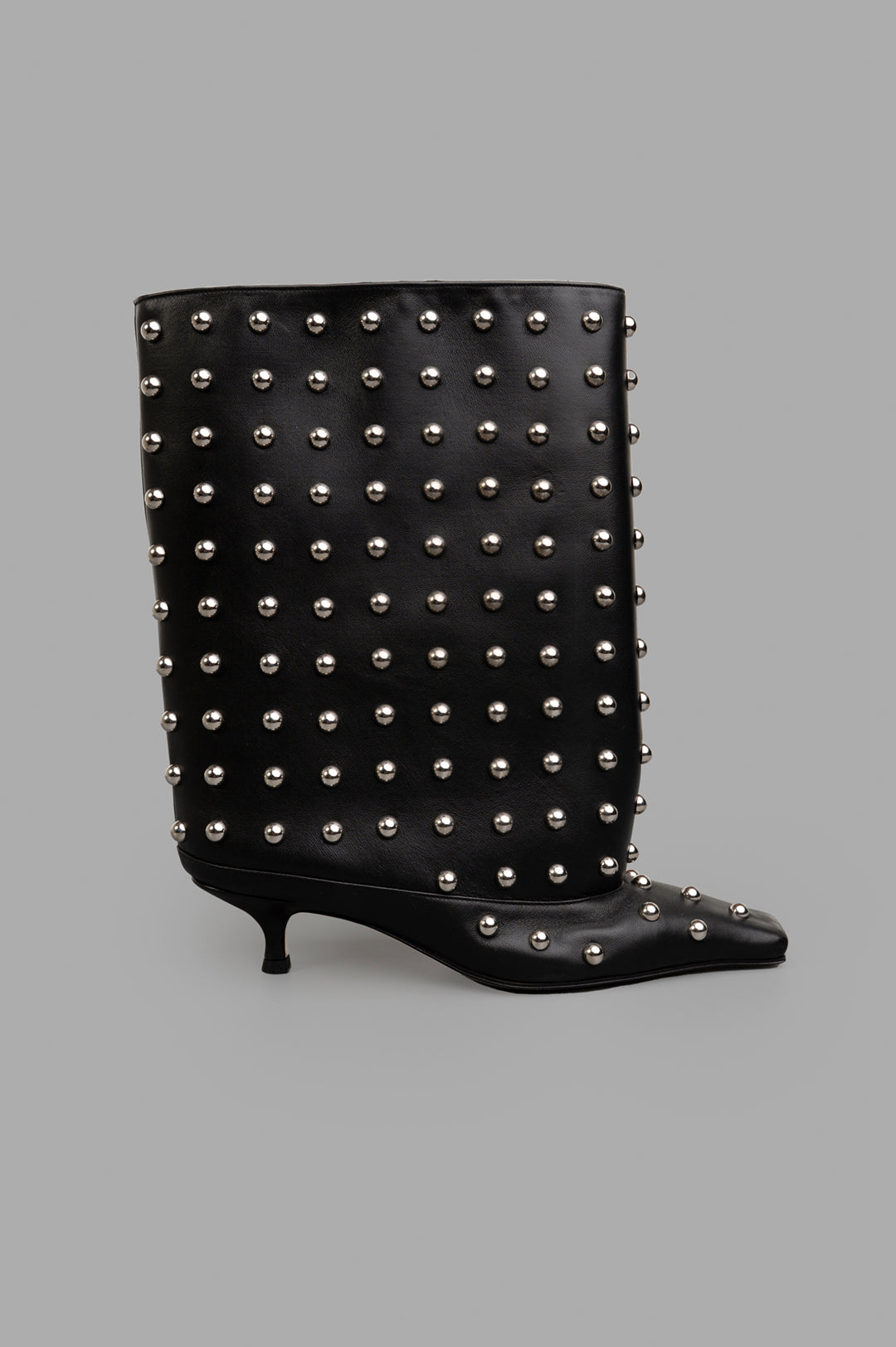 A.W.A.K.E. MODE Cylinder Boots, side view of mid-calf black leather with stud embellishments and pointed toe.