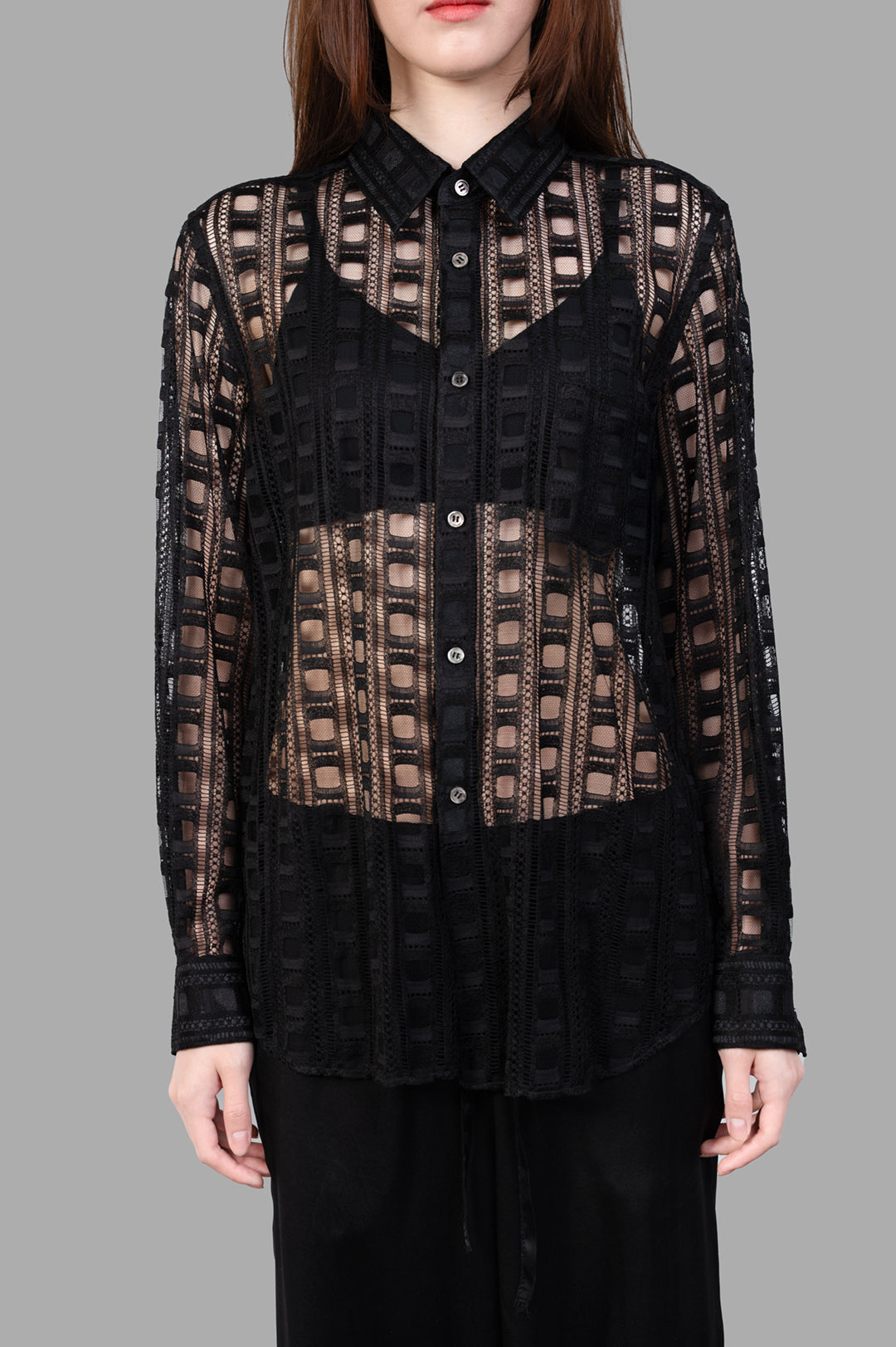Comme des Garçons Embroidered Shirt in black, showcasing front button fastening and intricate details on-model.
