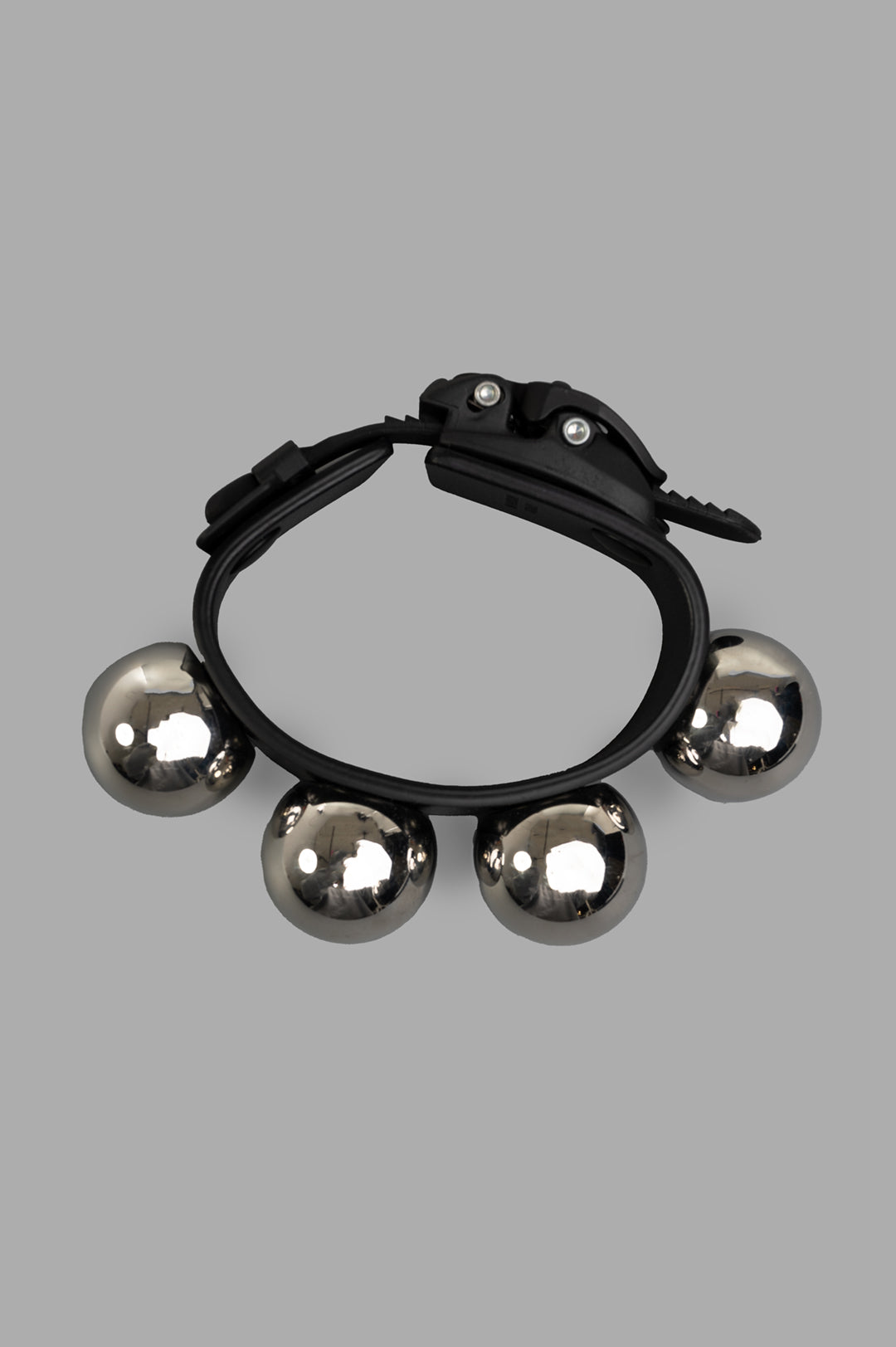 Innerraum Silver Stud Bracelet features bold, reflective spheres on a sleek black band, showcasing modern artistry.