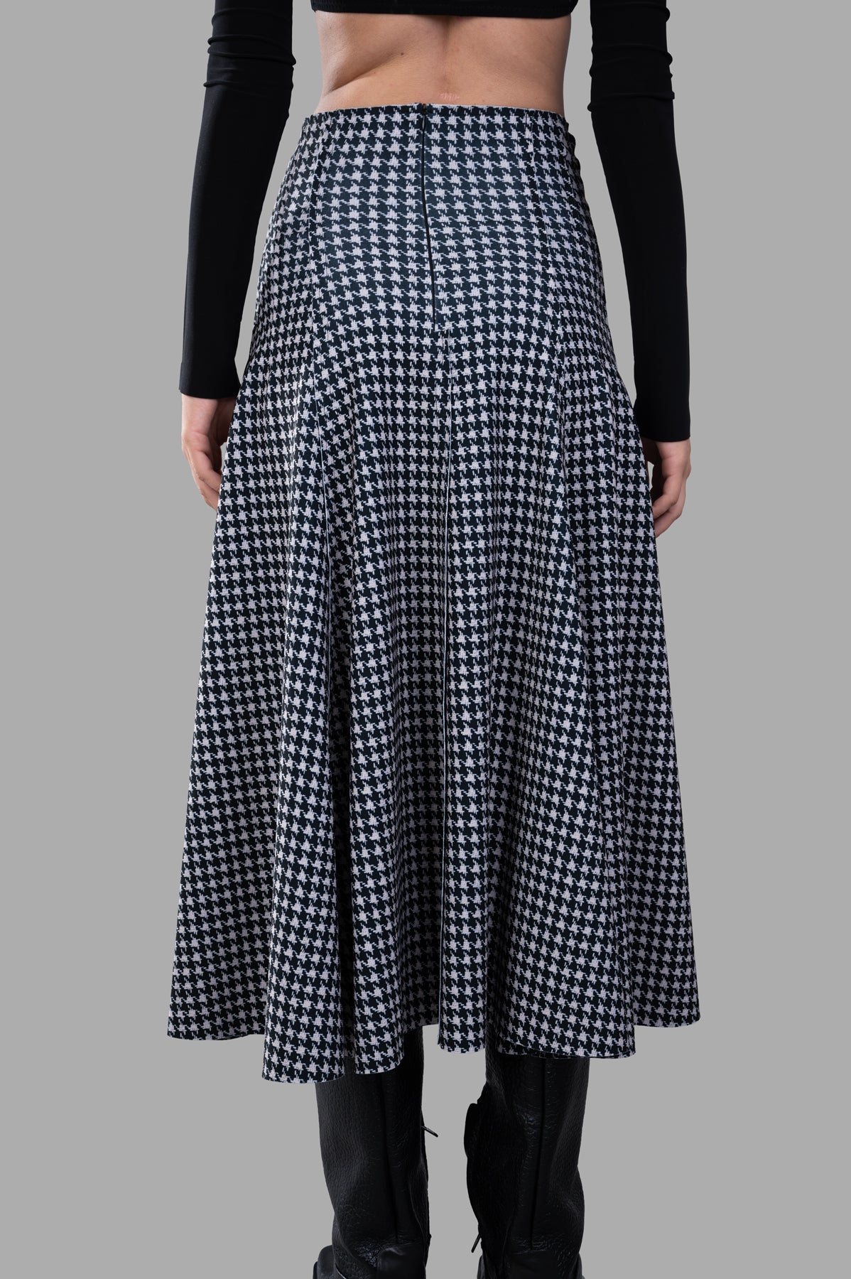 Norma Kamali Grace Houndstooth Skirt shown from the back, featuring a high waist and elegant A-line silhouette.