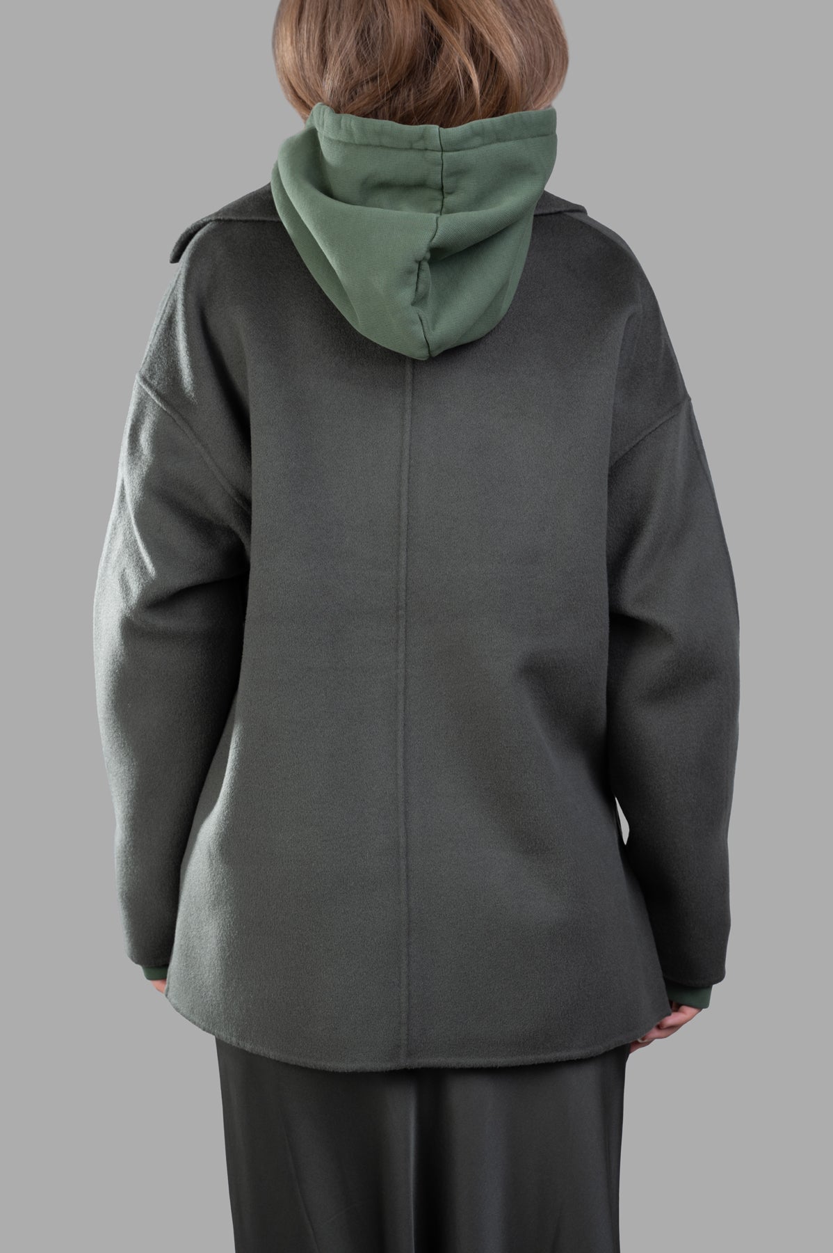 Anine Bing Luca Oversized Jacket in olive, showcasing back view with hood, dropped armholes, and soft wool-cashmere fabric.