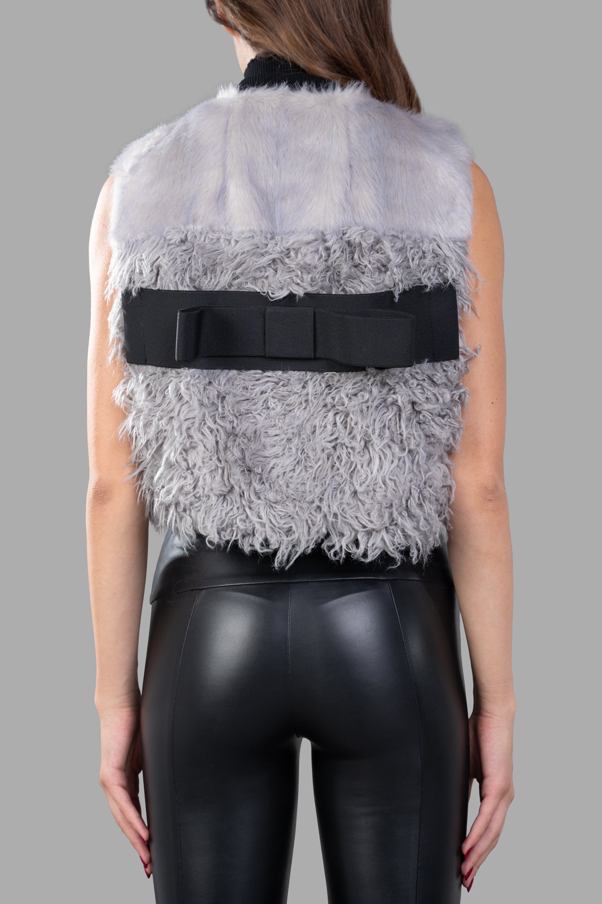 Alabama Muse Faux-fur Vest in grey, showcasing a cropped design with textured layers and a stylish black back bow.