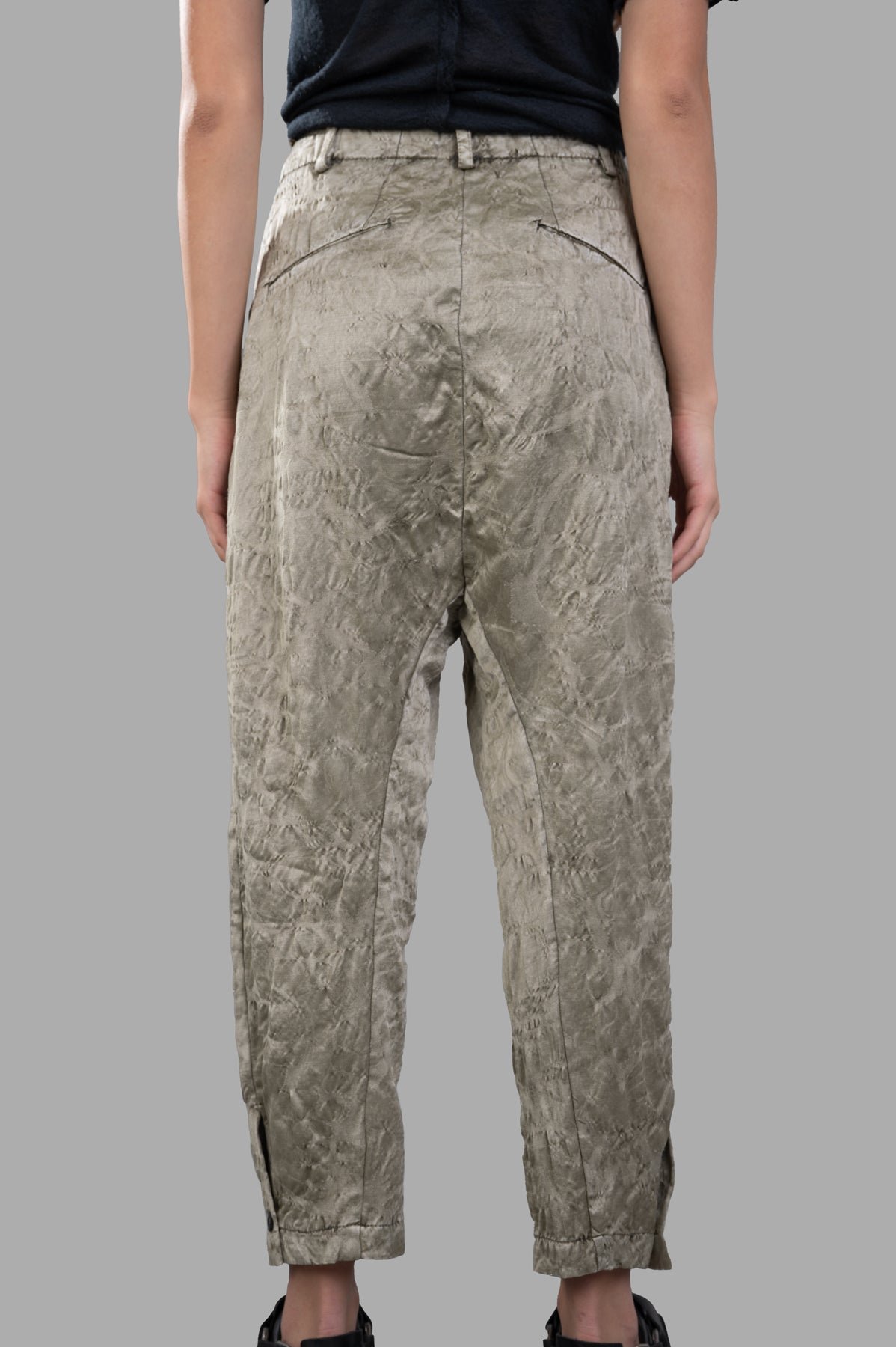 Masnada Textured Trousers in green, featuring a stylish drop crotch design and unique texture, viewed from the back.
