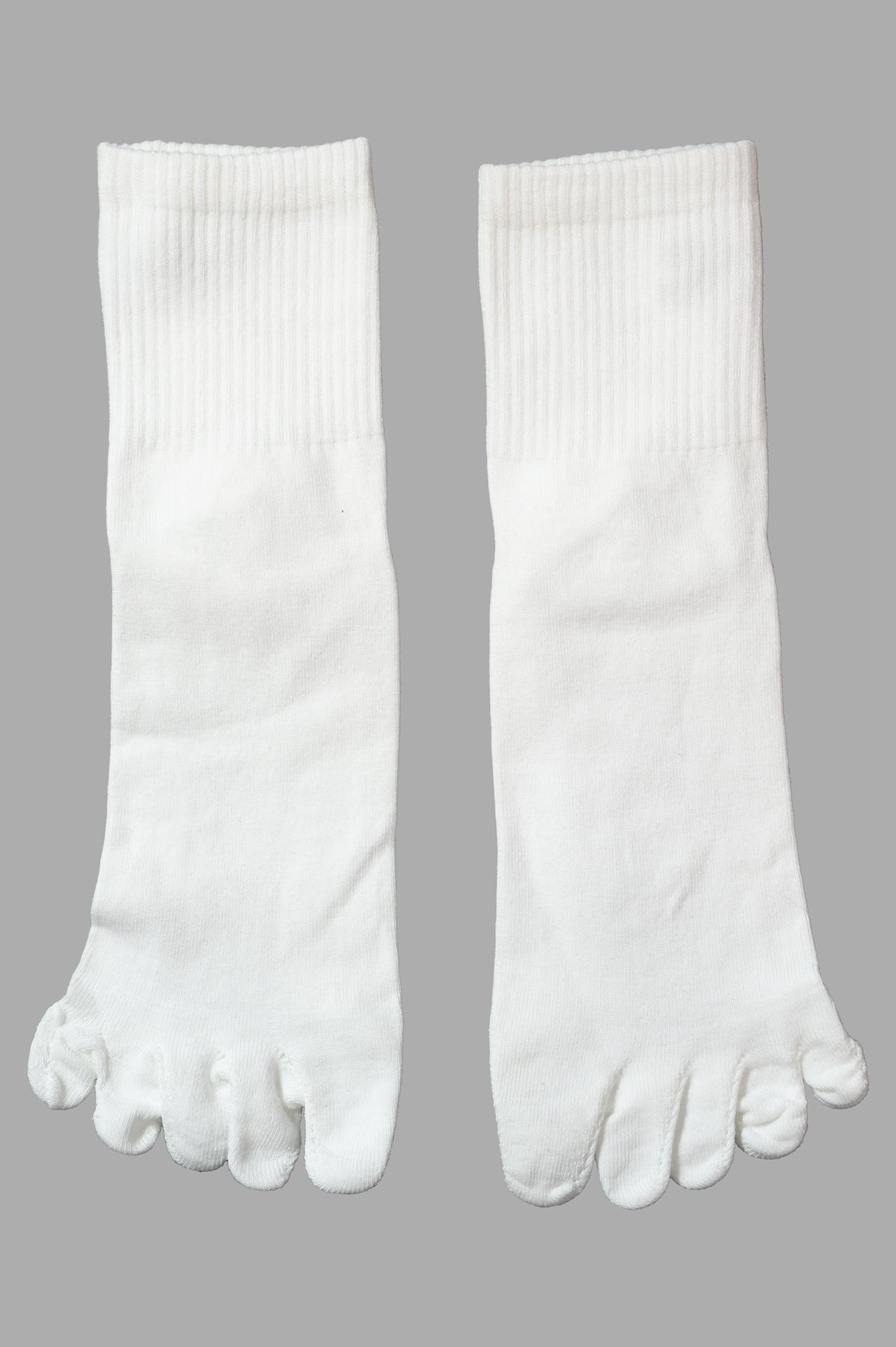 Natasha Zinko Alien Camp Socks, featuring a unique toe design, displayed flat to showcase their versatility and style.