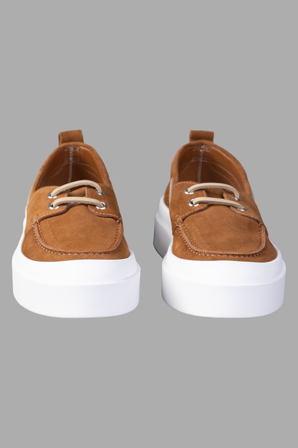 MSGM Suede Loafers in brown, featuring a front lace-up design and contrasting toecap, displayed from the front.