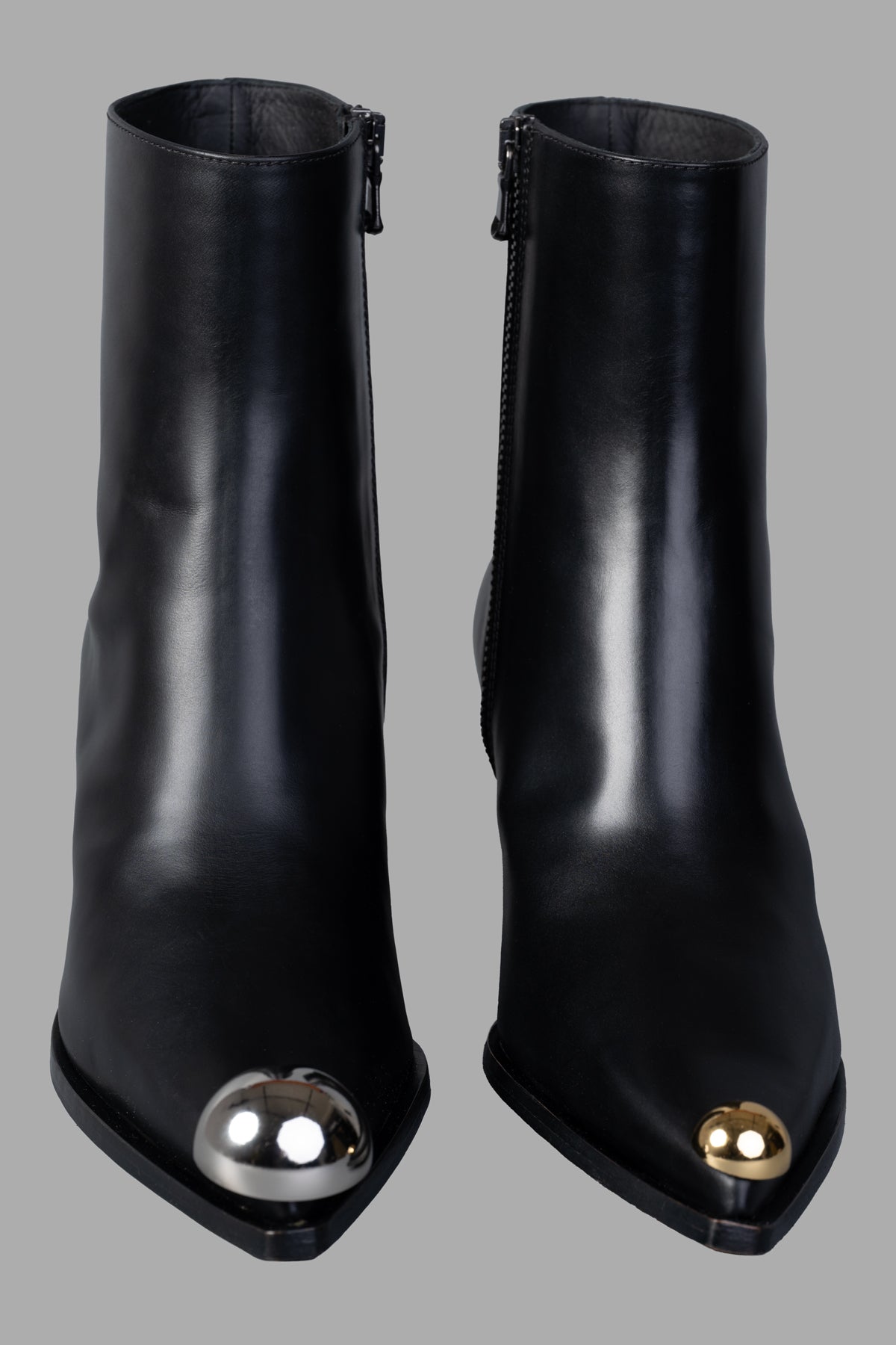 A.W.A.K.E. MODE Gabriel Cowboy Boots in black, featuring a sleek design with metallic toecaps and side zippers.