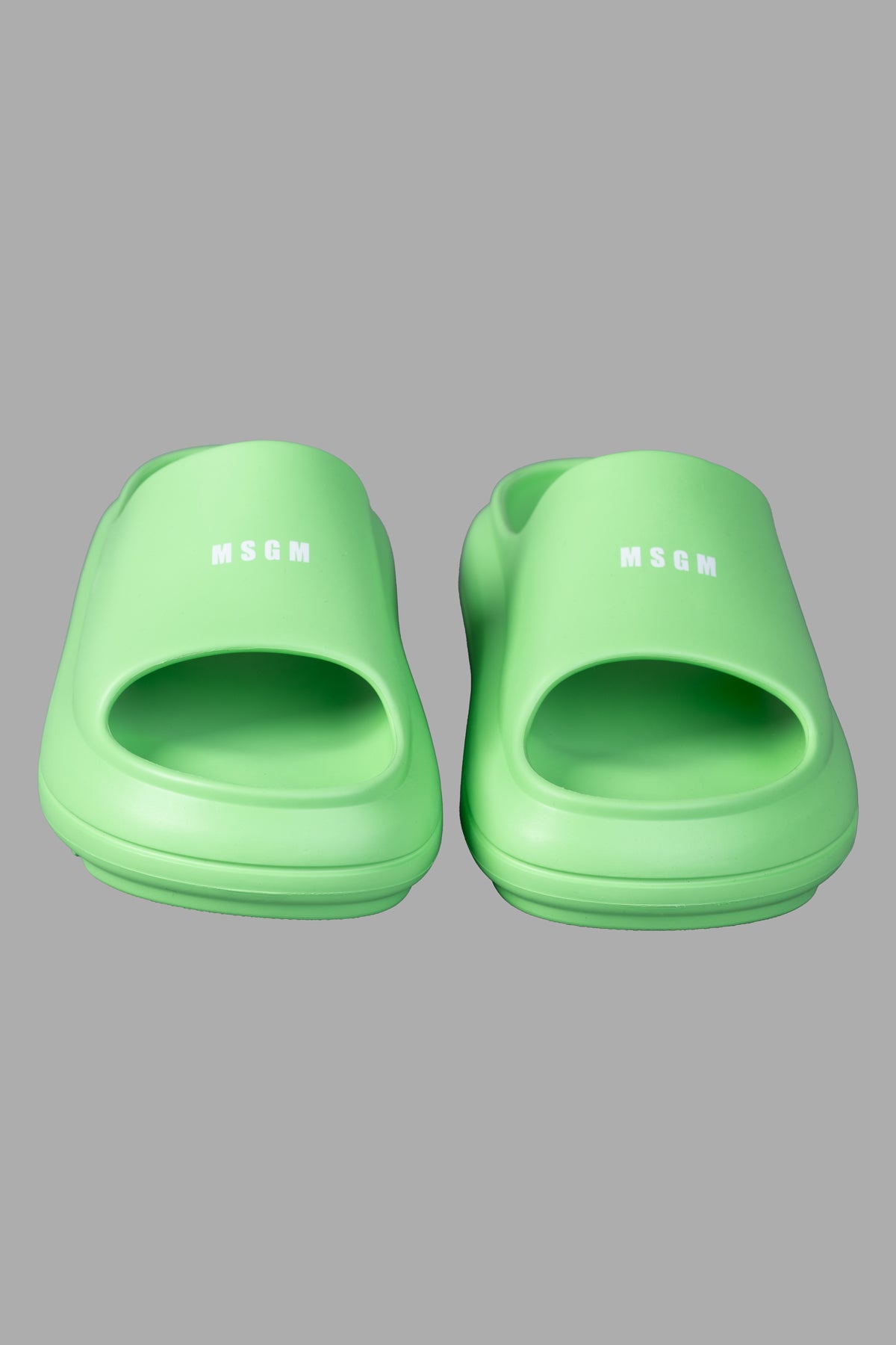 MSGM Ocean Club Sliders in vibrant green, featuring a sleek design with open toe and logo detail, perfect for summer style.