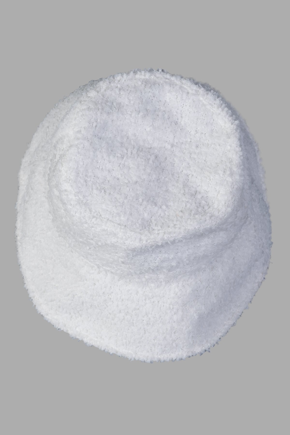 MSGM White Bucket Hat viewed from above, showcasing its soft texture and round shape, perfect for sunny days.