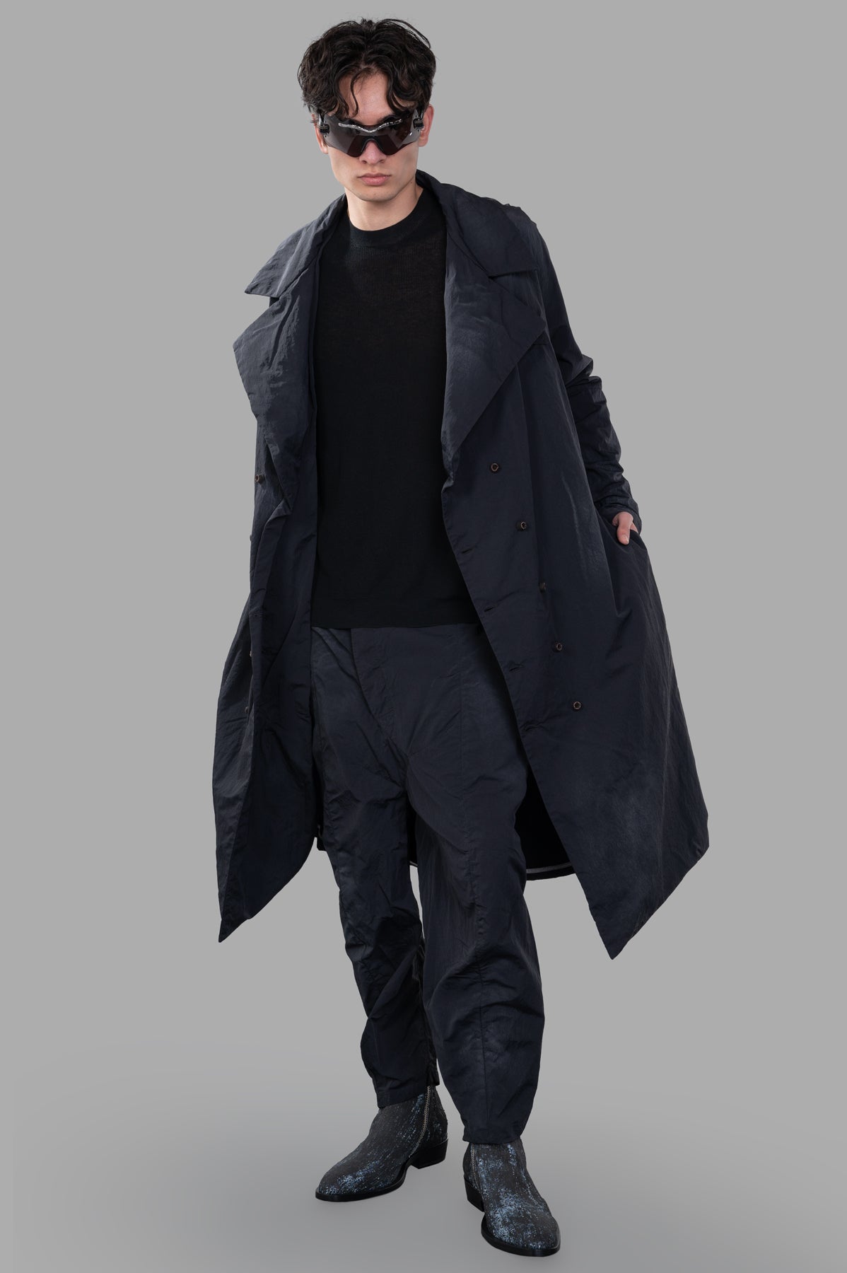 Marc Point Double-breasted Trench in black, on-model front view, oversized fit with belt and faded-effect pattern.