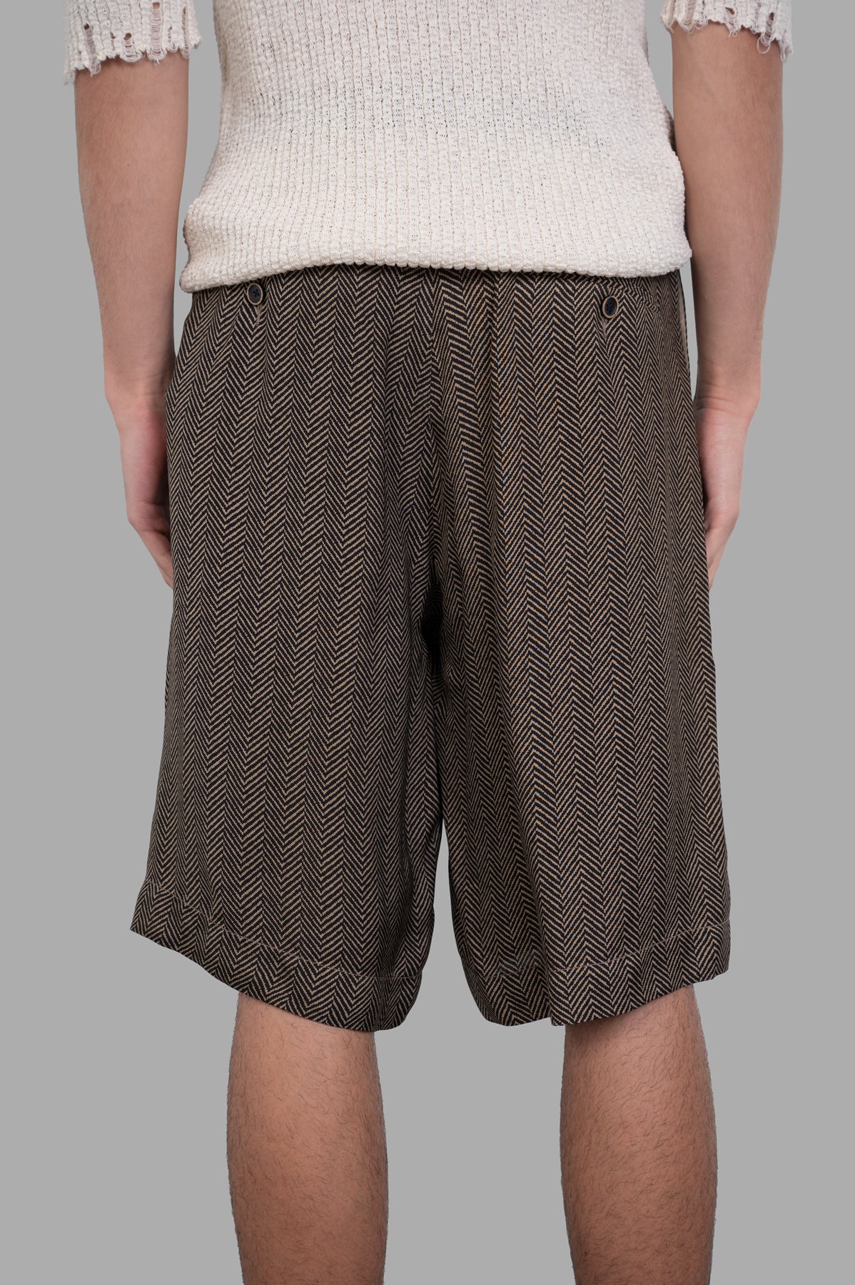 Uma Wang Herringbone Shorts featuring a drawstring waist, shown from the back with a stylish herringbone pattern in brown.