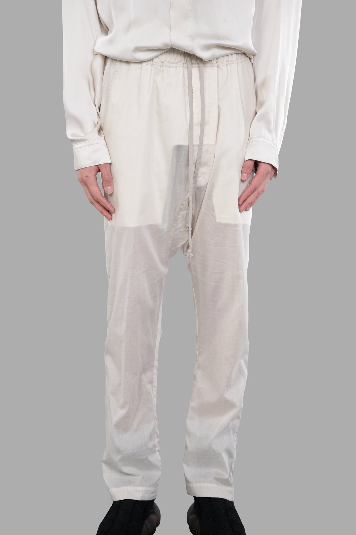 Rick Owens Semi-sheer Drawstring Pants featured front view showcasing elastic waistband and pockets, made of 100% cotton in.