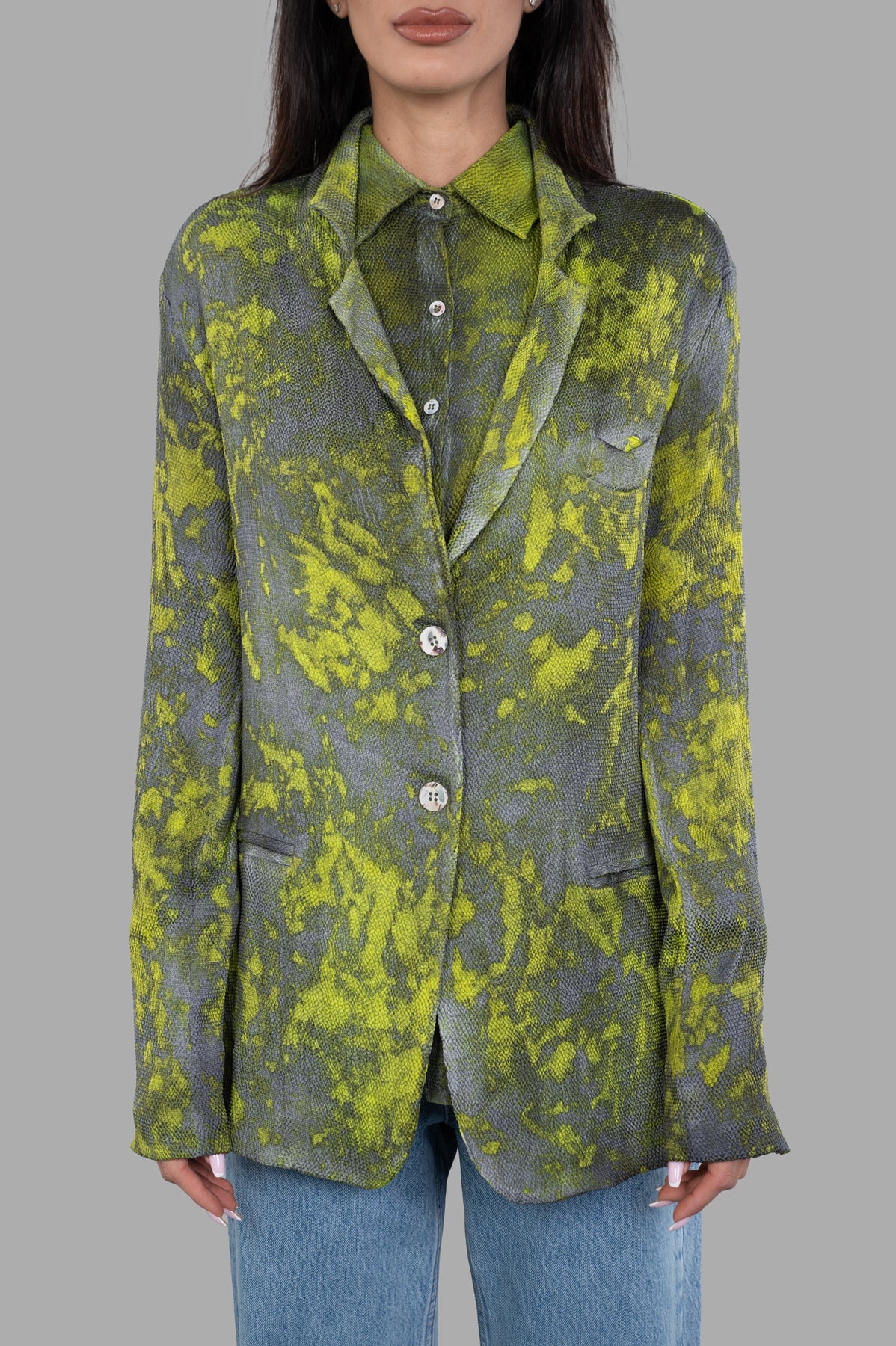 Avant Toi Camouflage Silk Blazer featuring vibrant lime and grey pattern, buttoned details, modeled for a chic look.