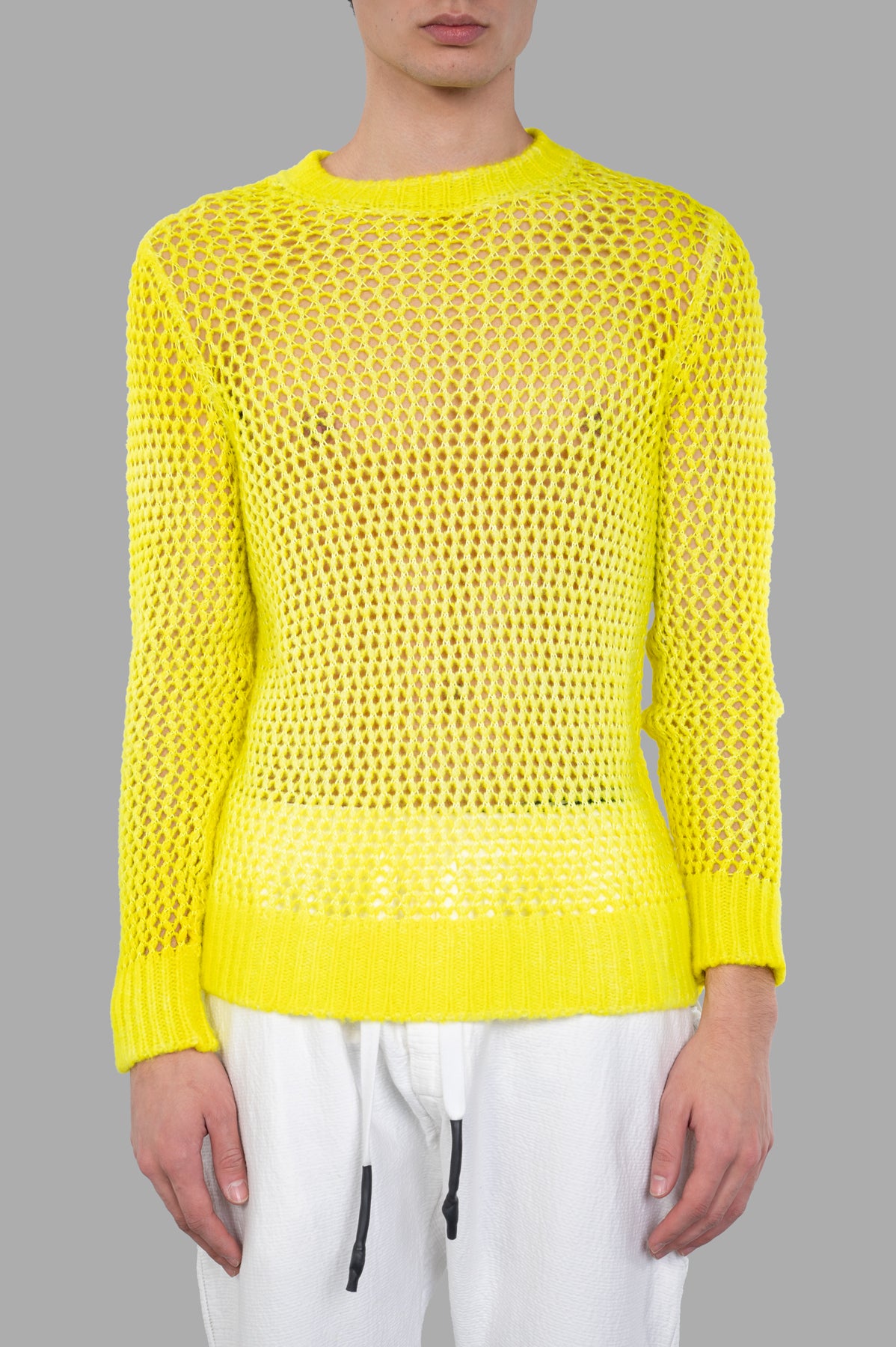 Avant Toi Open-knit Sweater in bright yellow, featuring ribbed cuffs and hem, showcased on a model.