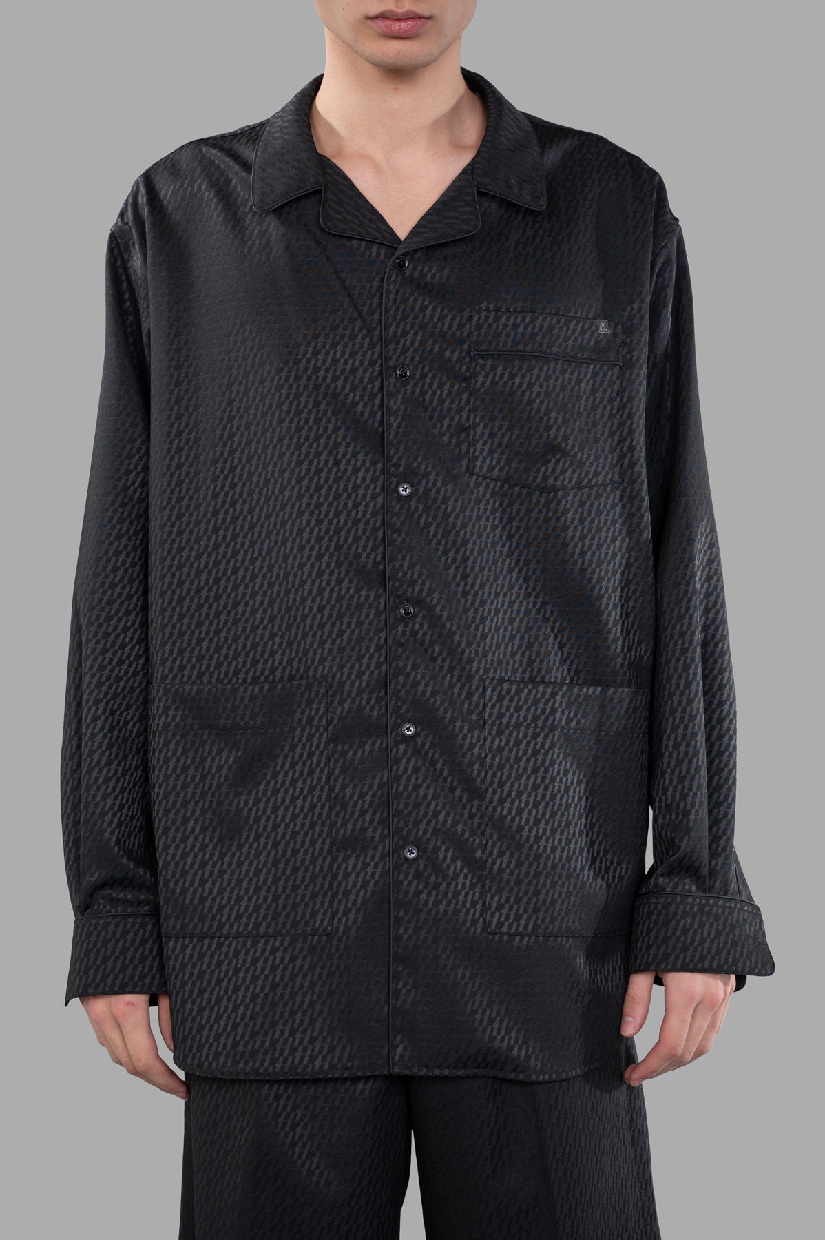 Helmut Lang Oversized PJ Shirt in black satin logo jacquard, featuring a button front and classic pajama details.