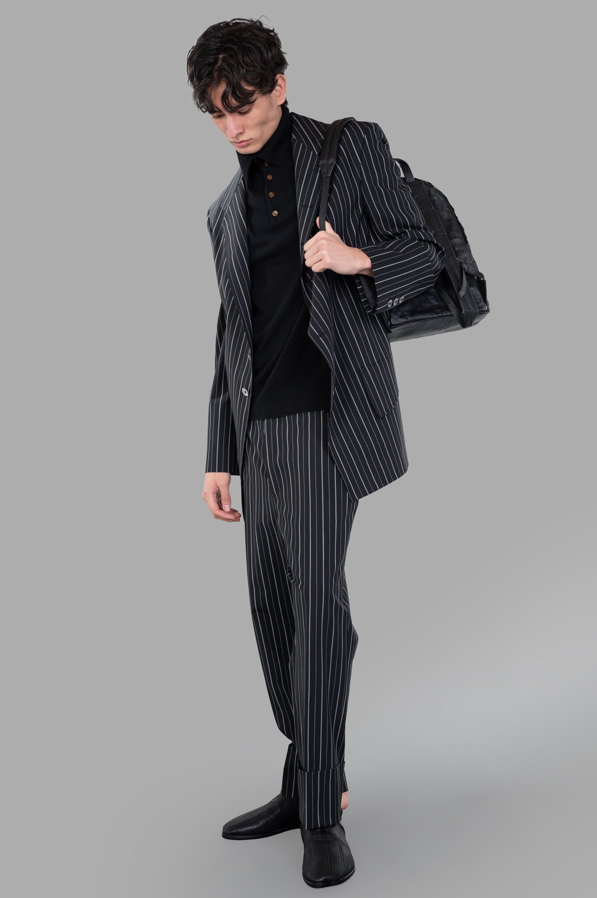 Vivienne Westwood DL Pinstripe Jacket, black, front view on model, showcasing classic longline silhouette and lapel design.