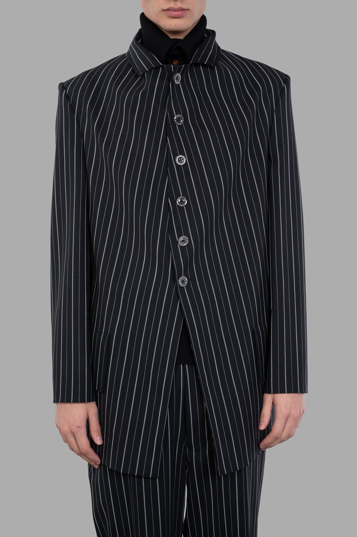 Vivienne Westwood DL Pinstripe Jacket front view featuring classic pinstripe pattern and detailed mother-of-pearl buttons.