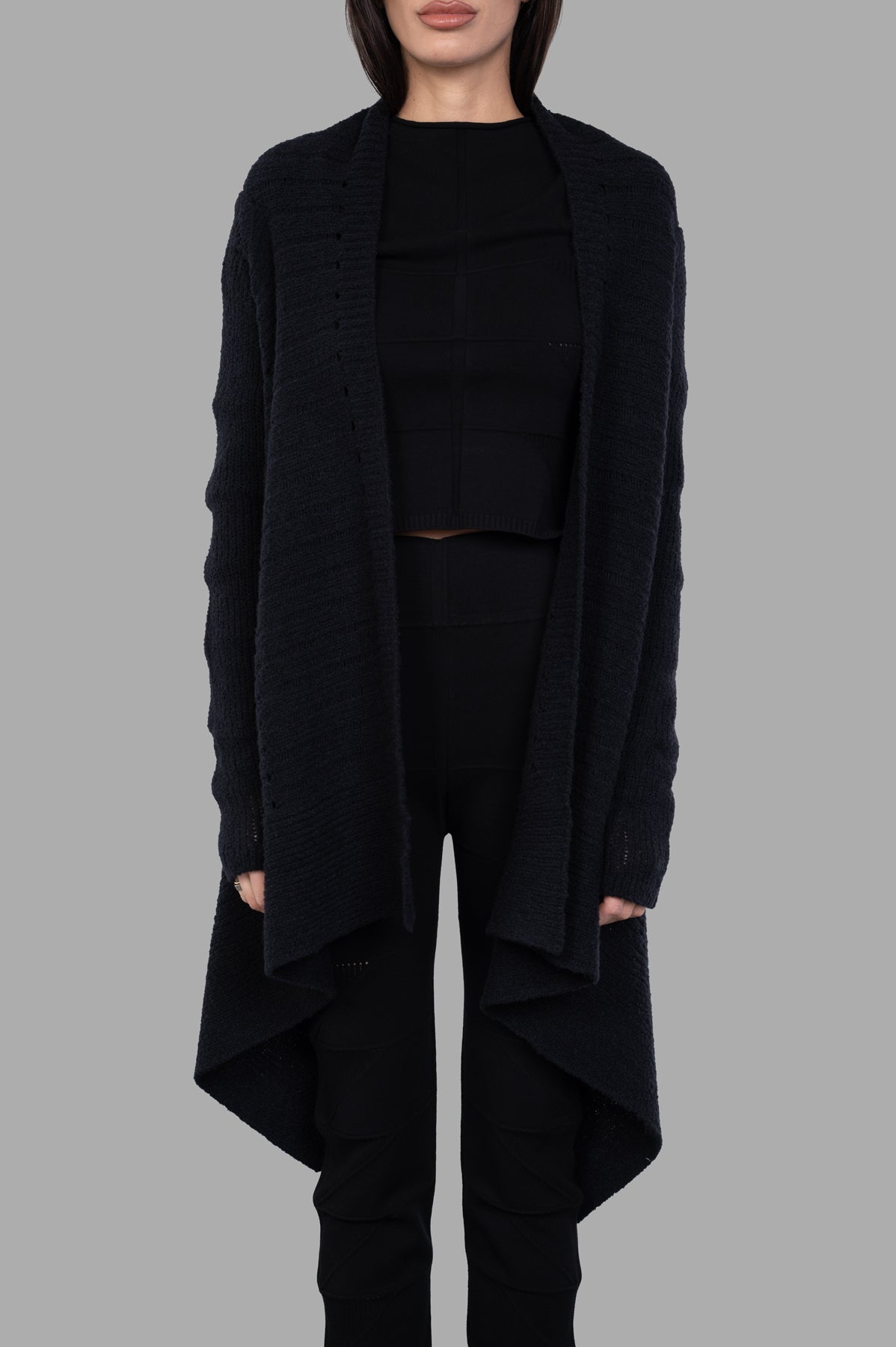 Rick Owens Draped Cardigan in black, featuring a loose-fit design, open front, and below-the-hip length for a stylish drape.