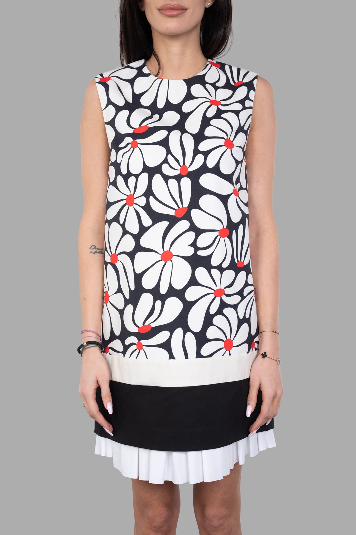 MSGM Floral Dress featuring a playful 60s-inspired floral print with pleats, modeled from the front in black and white.