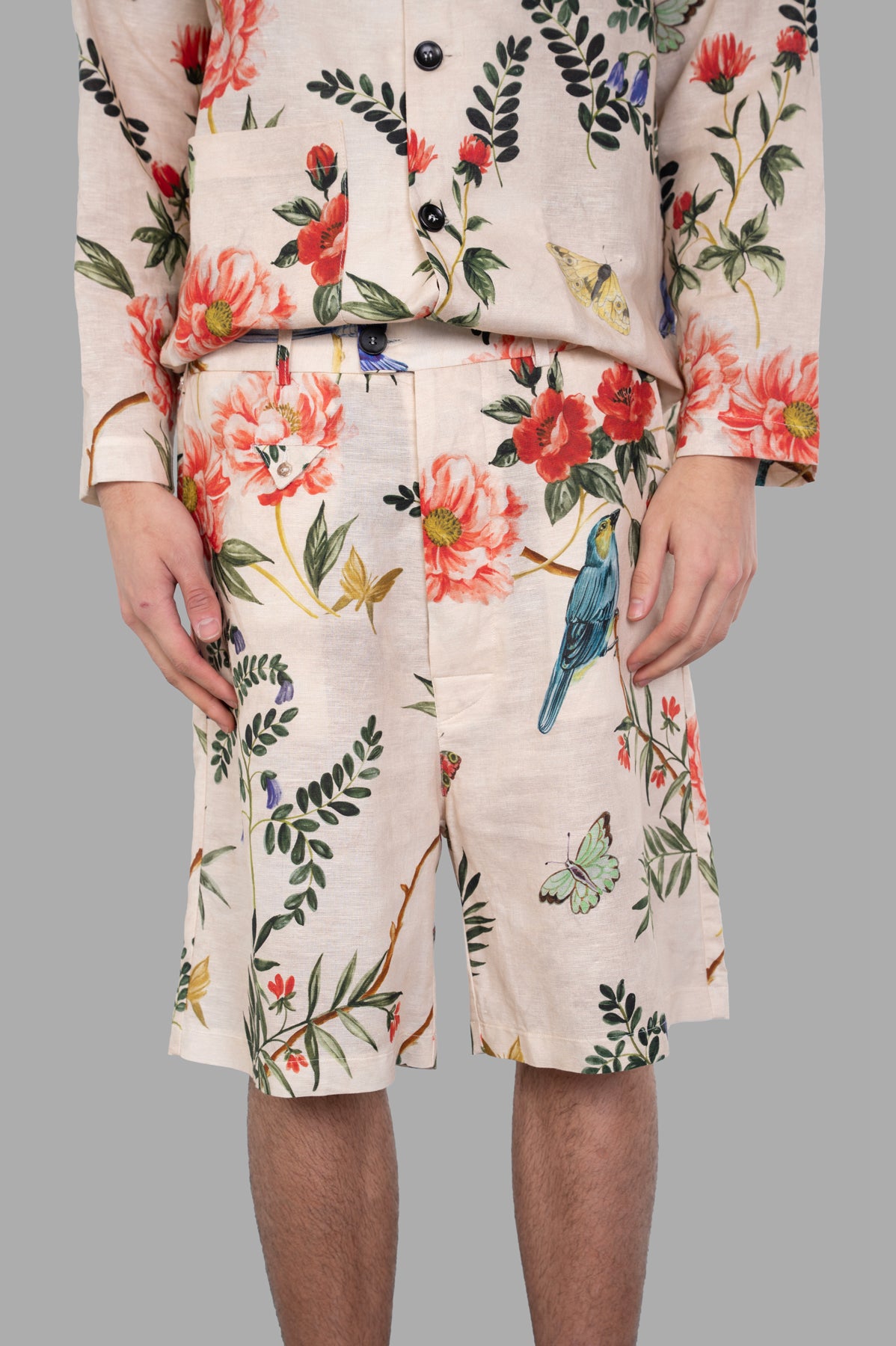 Marc Point. Floral-pattern Shorts with vibrant floral design, shown front and close-up, featuring side pockets and relaxed fit.