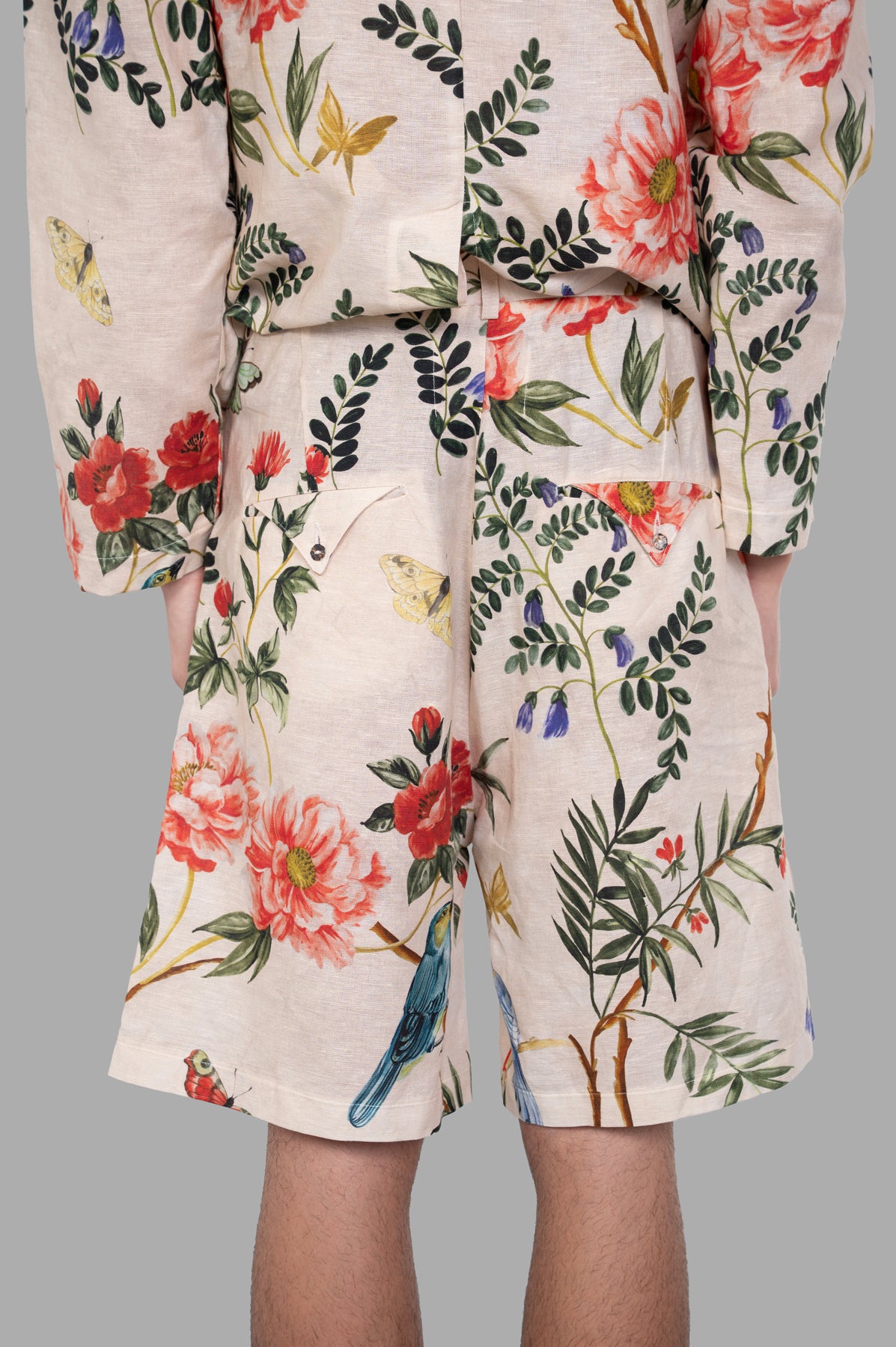 Marc Point Floral-pattern Shorts featuring a detailed floral design, back pockets, and above-the-knee length fit.
