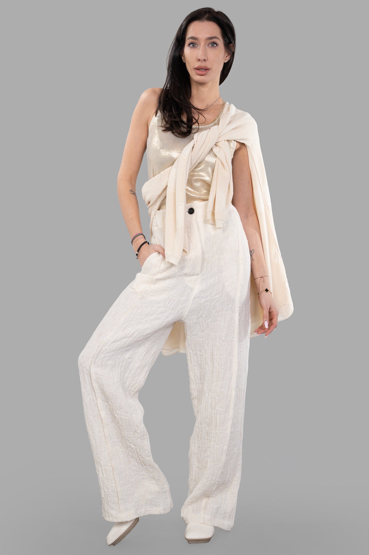 Marc Point Textured Trousers on-model, cream high-waisted design, relaxed fit with distinctive tactile texture, front view.