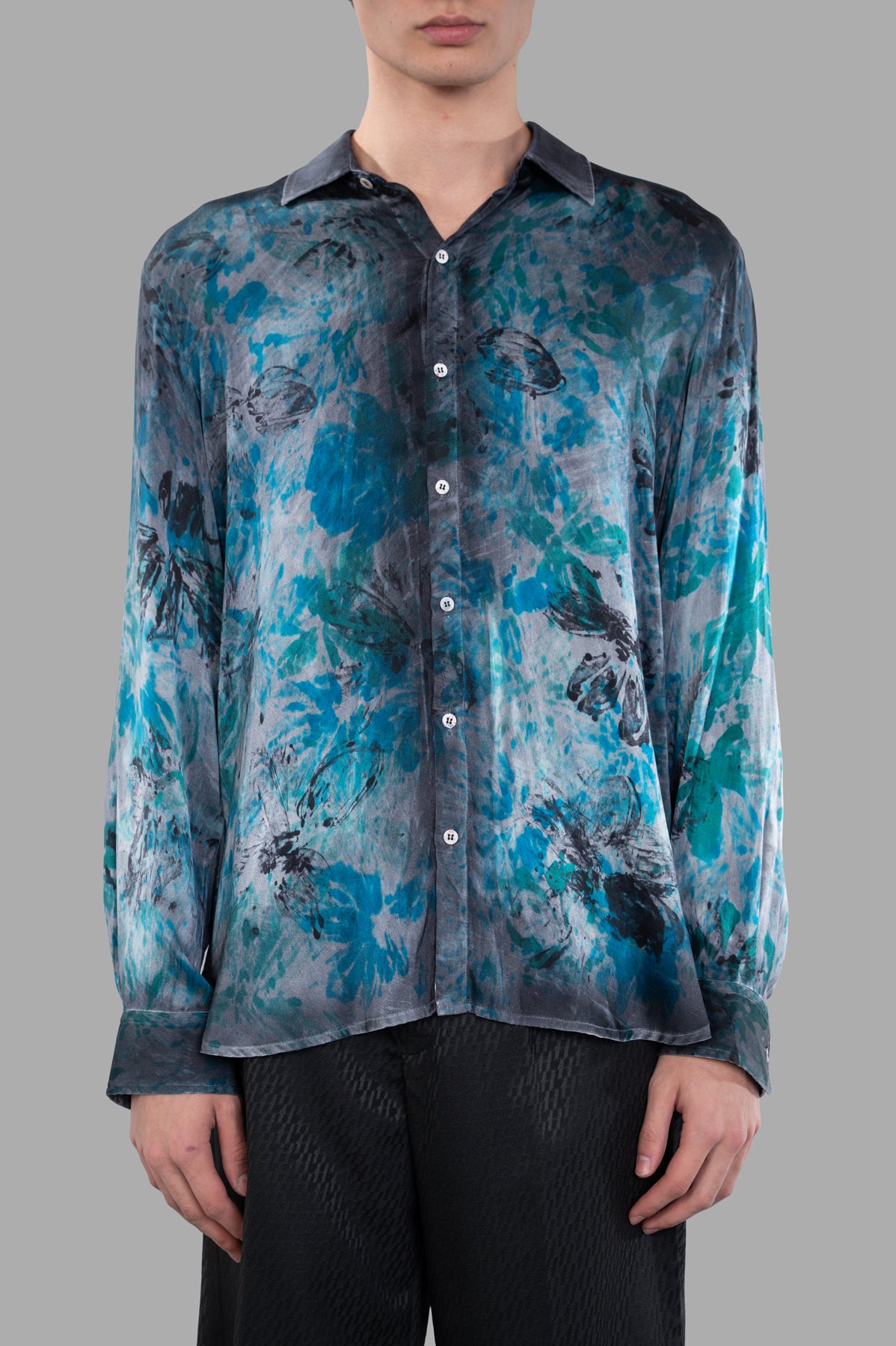 Avant Toi Abstract-print Shirt on model featuring vibrant floral design, button-up front, and long sleeves.