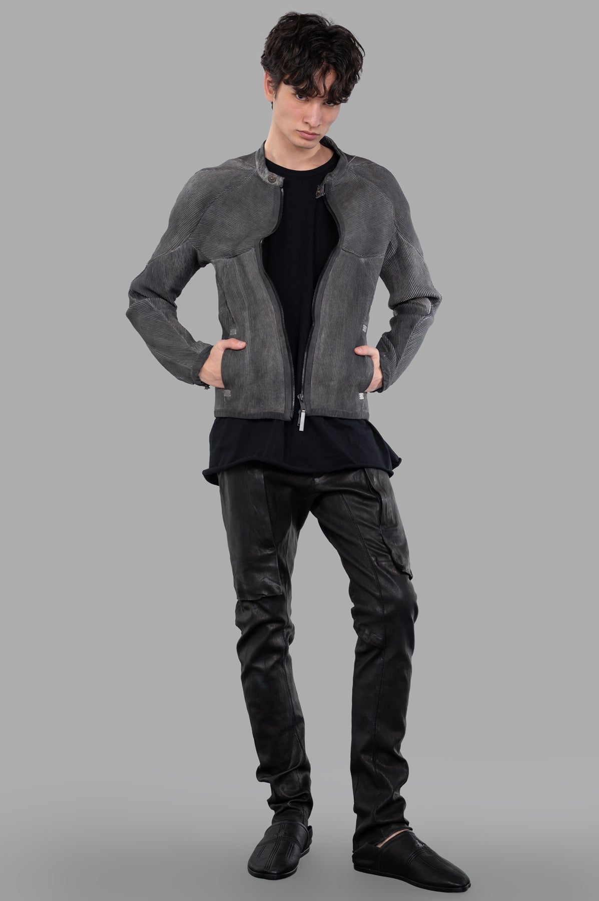 Isaac Sellam Musculaire Jacket in grey leather, front view on-model, features bold zip fastening and side pockets.