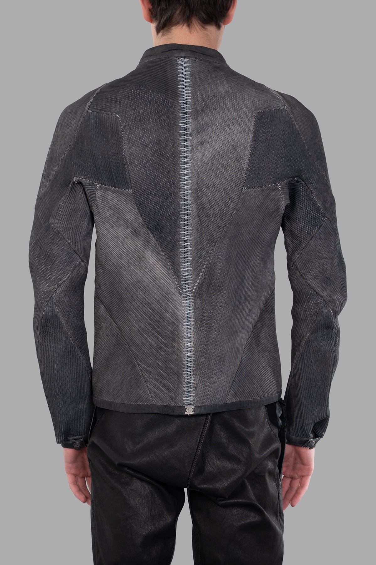 Isaac Sellam Musculaire Jacket in sleek grey, showcasing the back design with textured leather and unique seam detailing.