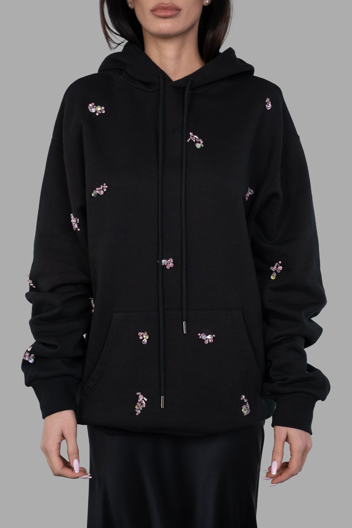 DES PHEMMES Bedazzled Hoodie, black with jewel embellishments, shown on model, featuring a hood and front pocket.