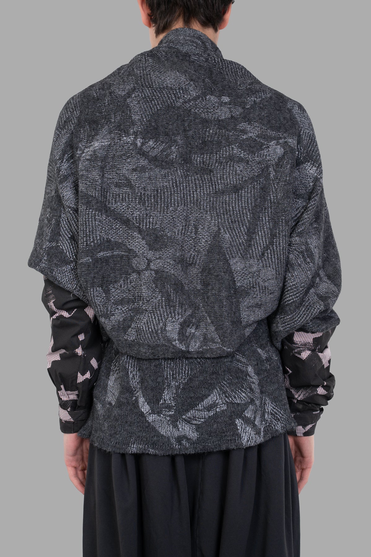 Vivienne Westwood Hi-Vis Poncho Scarf showcasing the back view with a soft alpaca-blend and “Ermine Flower” motif.