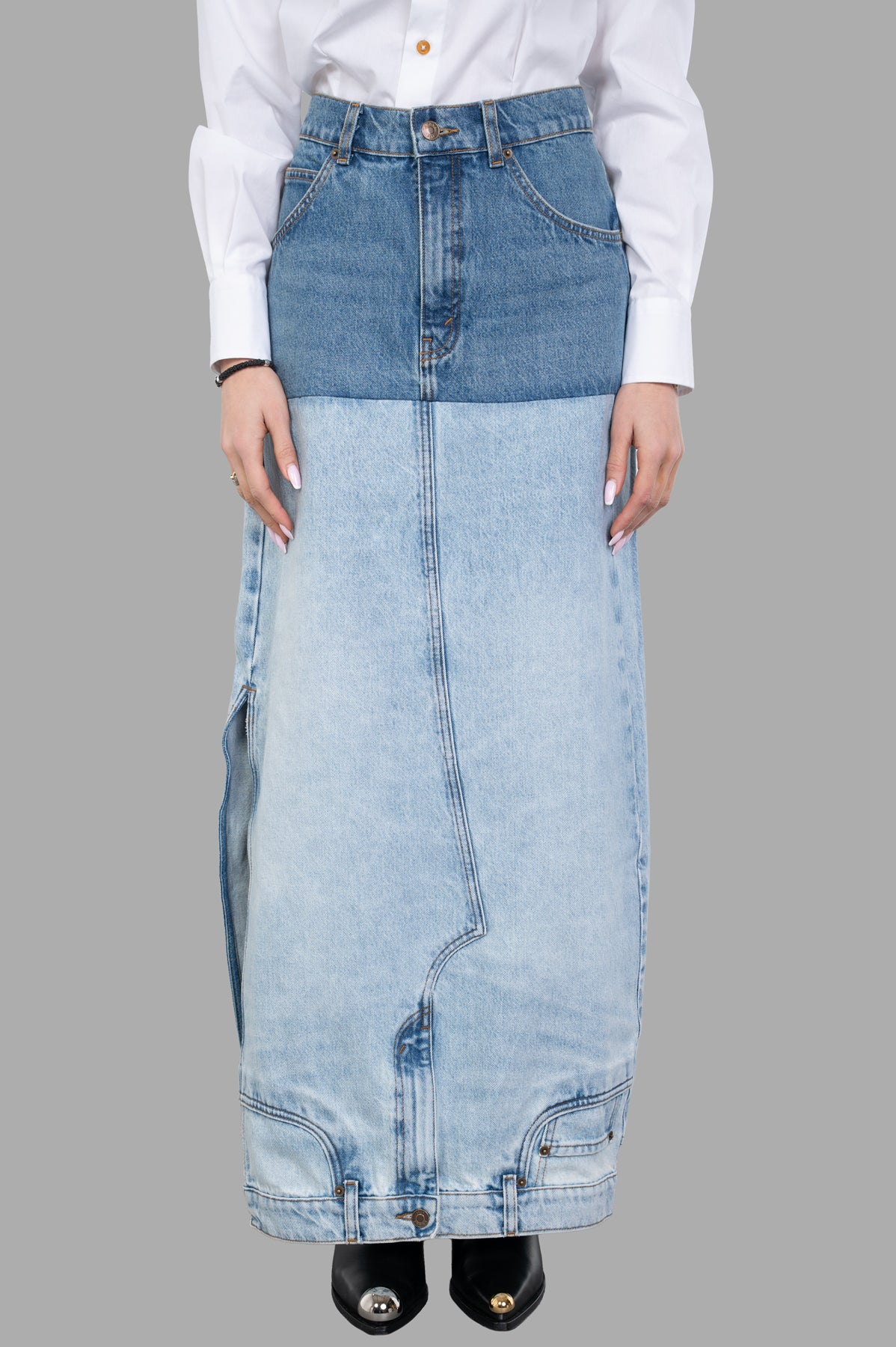 A.W.A.K.E. MODE Mirror-effect Skirt in blue, featuring a unique two-tone design, shown on model with detailed denim texture.
