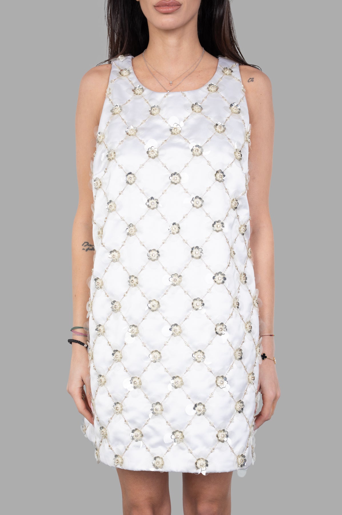 **Alt Text:** DES PHEMMES Bell Mini Dress, front view on model, features elegant floral embellishments and a sleeveless design.
