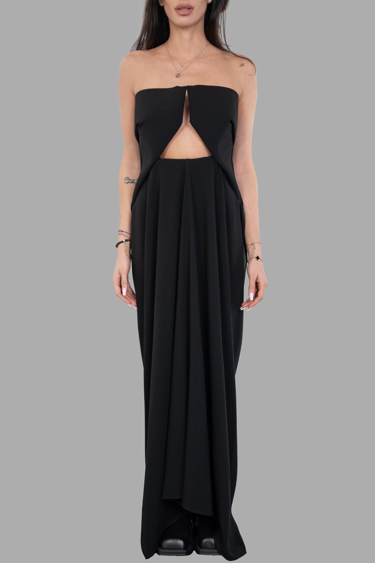 Rick Owens Amphora Prong Dress on model, showcasing a strapless design with a front cutout detail and flowing fabric.