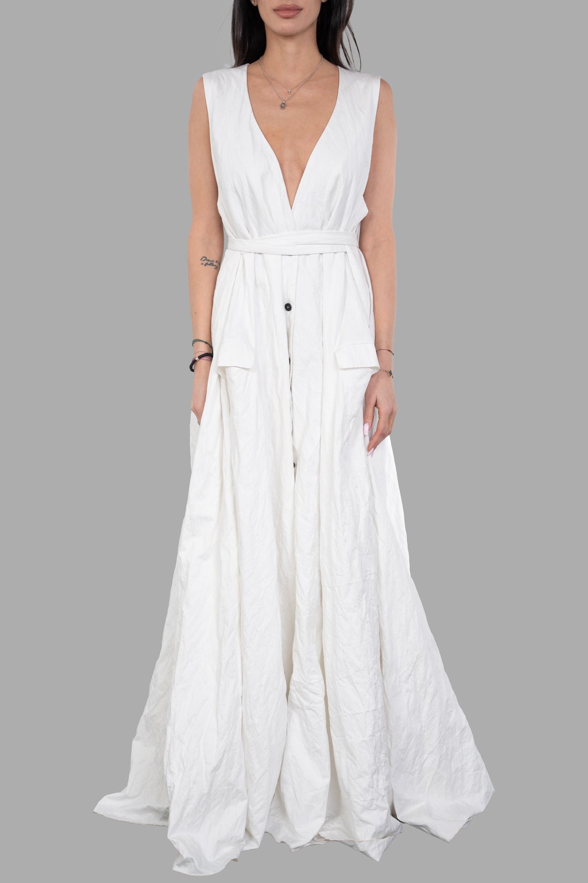 Marc Point Crinkled Dress in white on model, showcasing a plunging neckline and belted waist for a chic look.