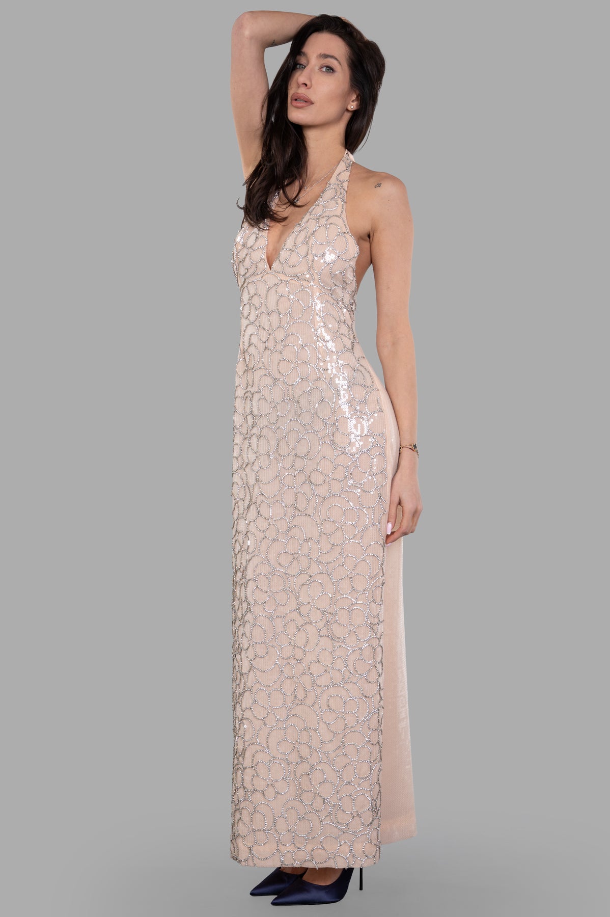 DES PHEMMES Sequined Floral Halter Dress in pink, front view on model, showcasing sleek column silhouette and beaded design.