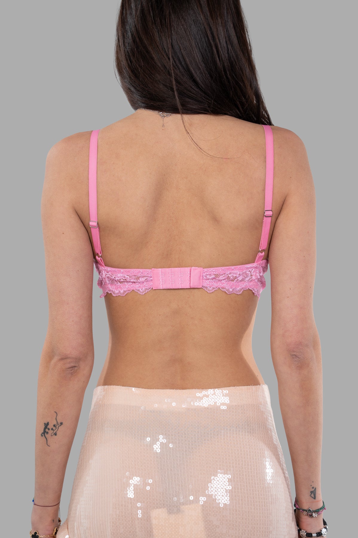 DES PHEMMES Lace Bra featuring a bright pink back view with lace detailing and adjustable straps, perfect for layering.
